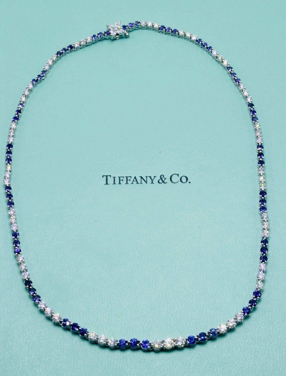 Tiffany & Co. 
Victoria Diamond & Sapphire Necklace in Platinum.  
Necklace consists of 57 Round Brilliant Diamonds 4.54 TCW G - I color, VVS1 - VS1 clarity, 60 Round Blue Sapphires 6.90 TCW VVS - VS clarity, and 4 Marquise Cut Diamonds 0.24 TCW G