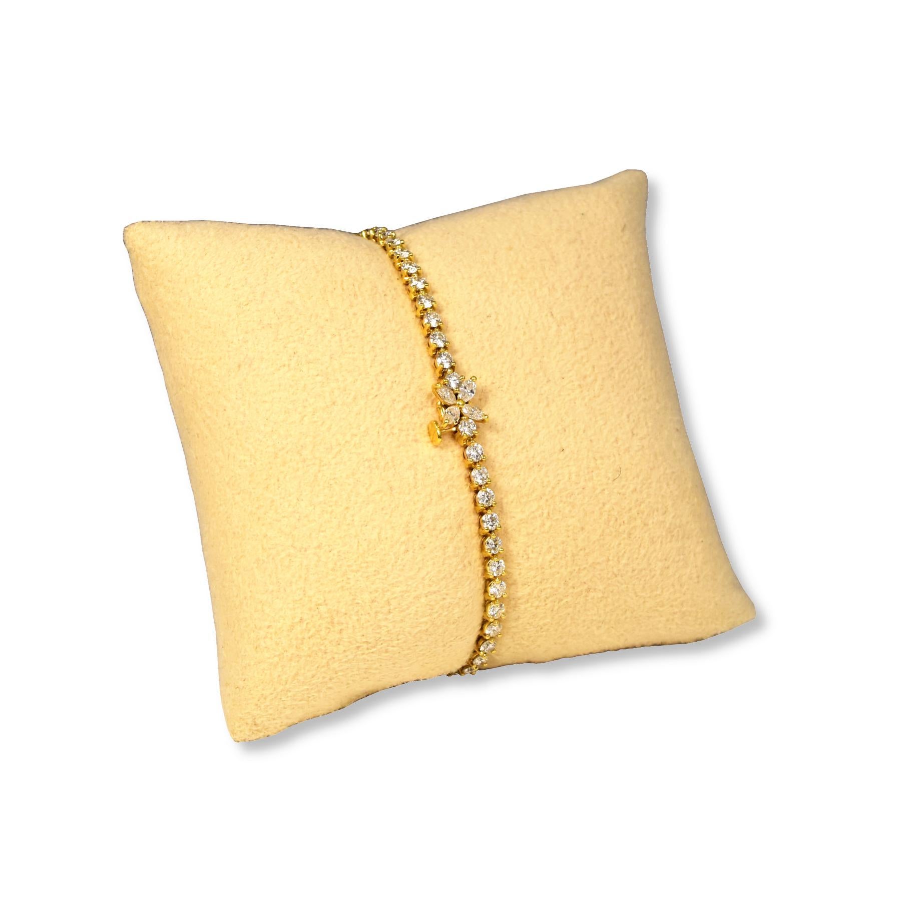 Designer: Tiffany & Co.

Collection: Victoria

Style: Tennis Bracelet

Metal:  Yellow Gold 

Metal Purity: 18K

Main Stone: 55 Diamonds

Main Stone Cut: Round Brilliant

Total Carat Weight: Approx. 3.09 TCW.


Bracelet Weight (grams): 7.9