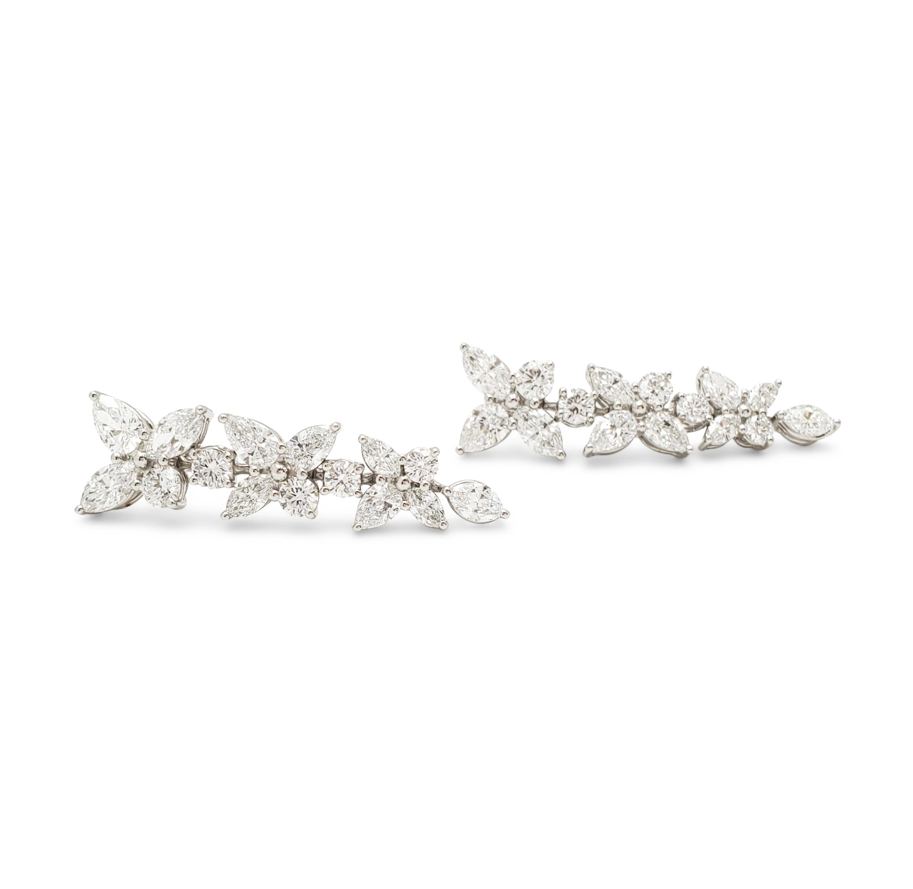 Authentic Tiffany & Co.  Victoria mixed cluster drop earrings crafted in Platinum.  The earrings are a playful twist on Tiffany & Co.'s iconic Victoria design featuring a mix of marquise, pear-shaped, and round brilliant cut diamonds of an estimated