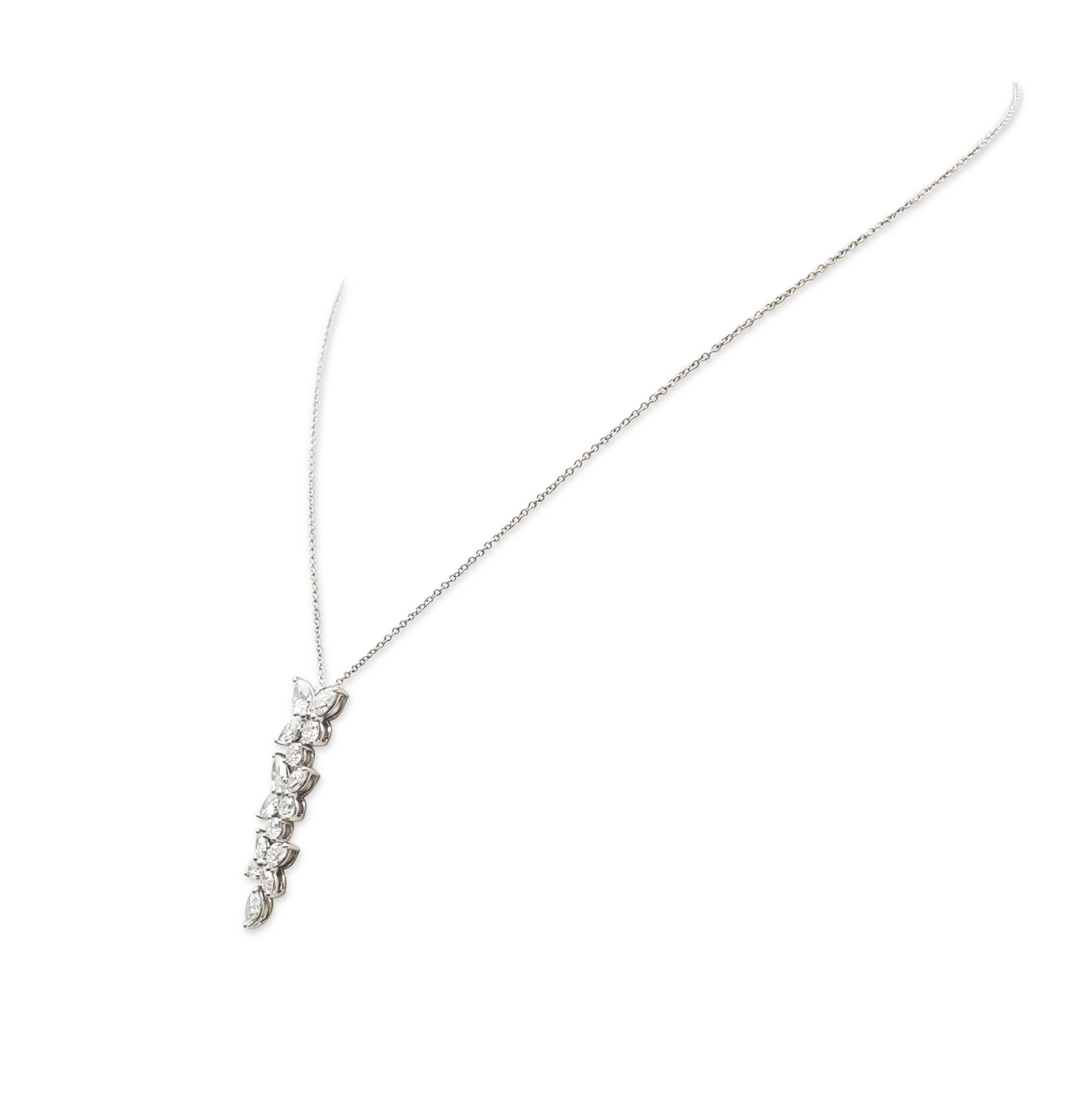 Authentic Tiffany & Co. Victora mixed cluster pendant crafted in platinum.  The necklace is a playful twist on Tiffany & Co.'s iconic Victoria design featuring a mix of marquise, pear-shaped, and round brilliant cut diamonds of an estimated 2.12