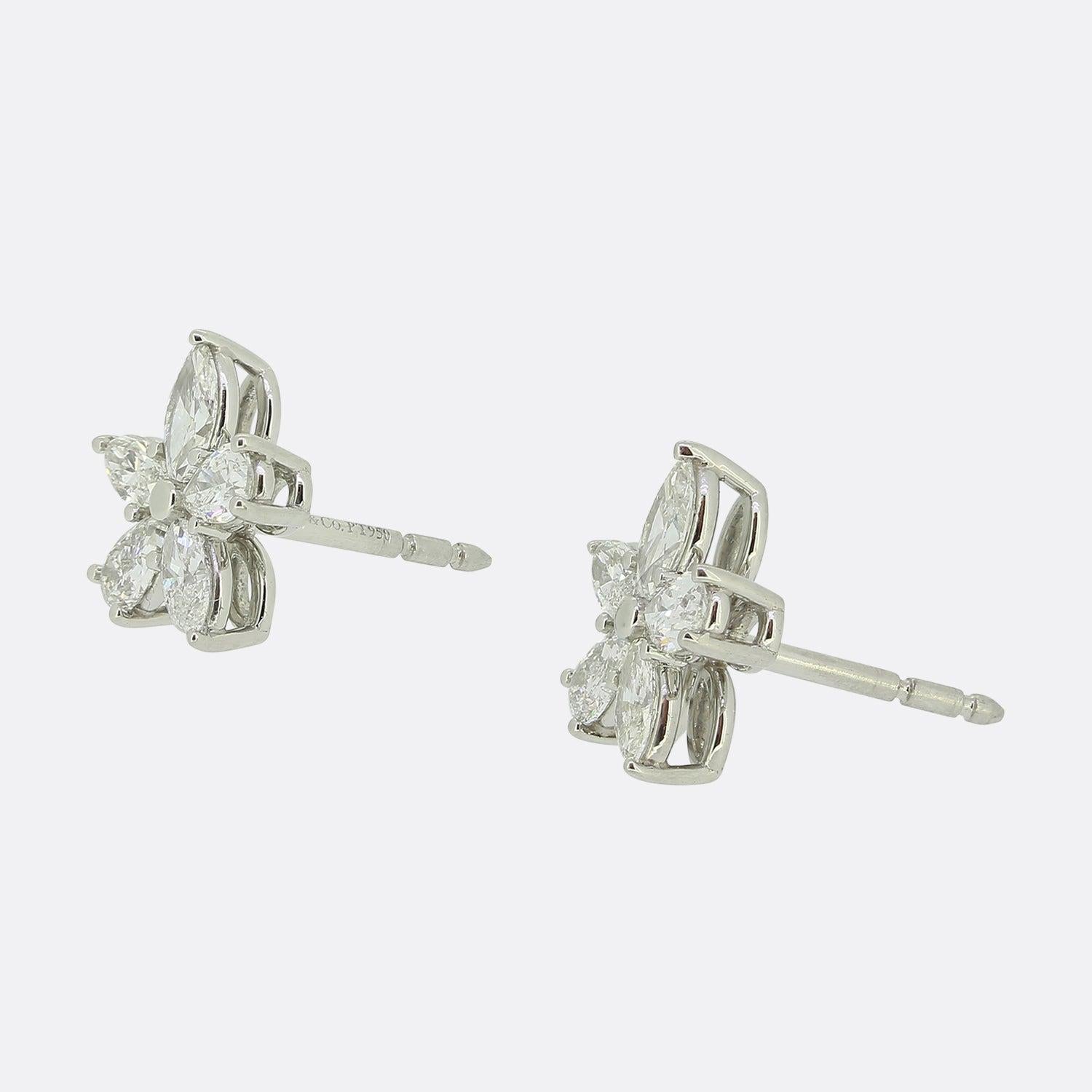 Here we have a stunning pair of diamond earrings from the world renowned luxury jewellery designer Tiffany & Co. These earrings form part of the Victoria collection and showcase a duo of marquise cut diamonds and a trio of pear shaped diamonds; each