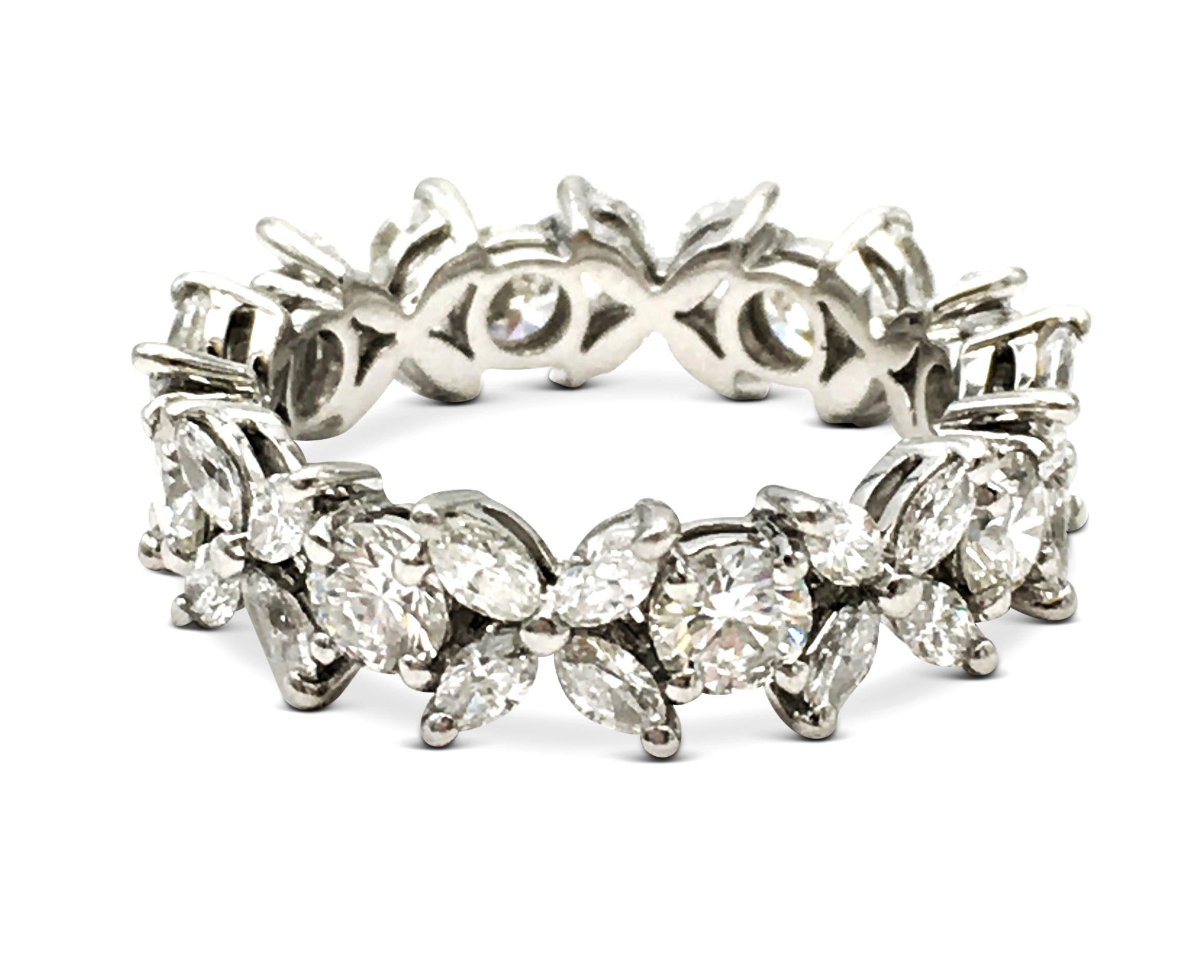 Authentic Tiffany & Co. 'Victoria' alternating band ring crafted in platinum and prong set with high-quality round brilliant cut diamonds weighing an estimated 1.04 carats total weight and marquise diamonds brilliant cut diamonds weighing an