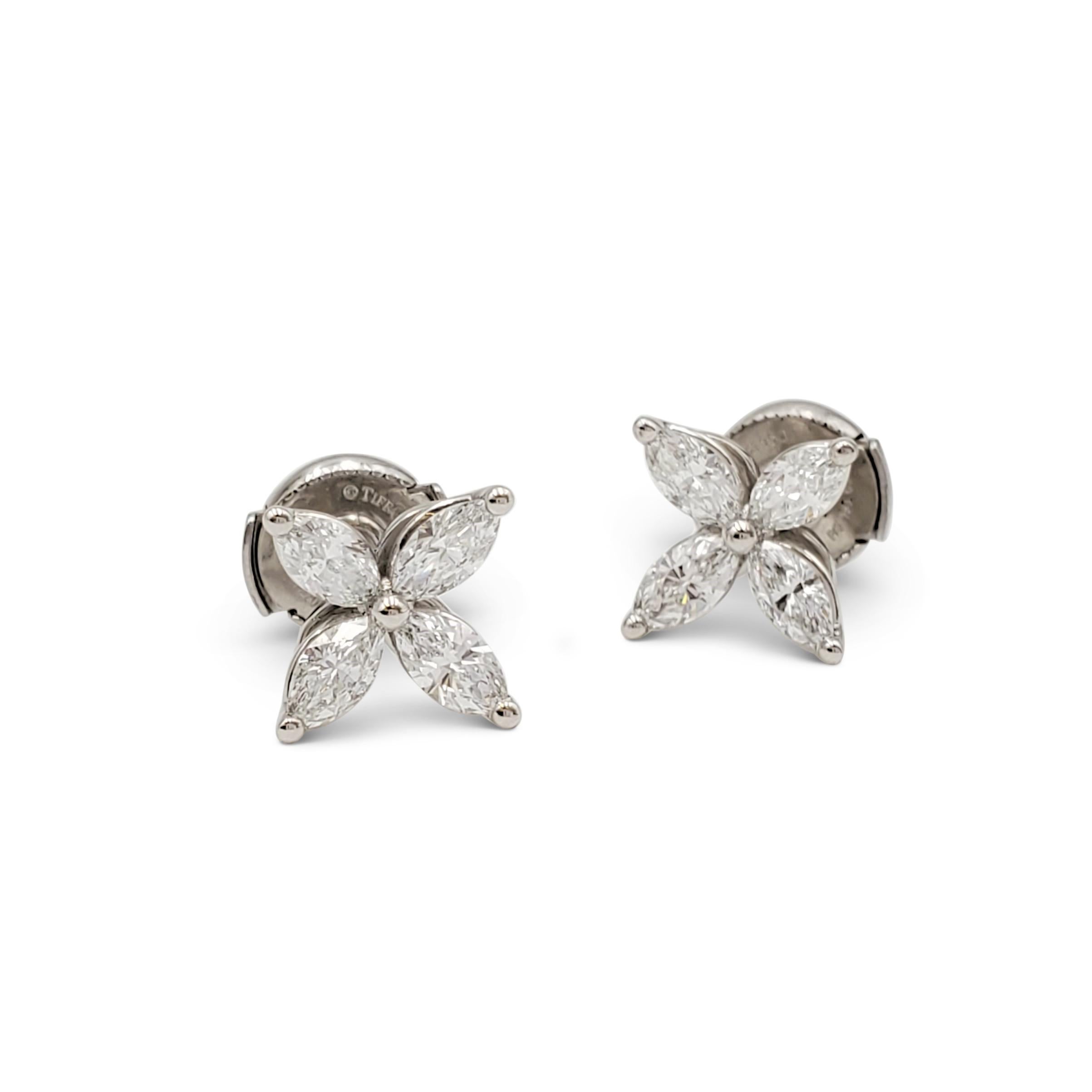 Authentic Tiffany & Co. 'Victoria' earrings crafted in platinum and set with sparkling marquise-shaped diamonds (E-F color, VS clarity) weighing an estimated 0.92 carats total weight. Signed Tiffany & Co., PT 950. The earrings are presented with the