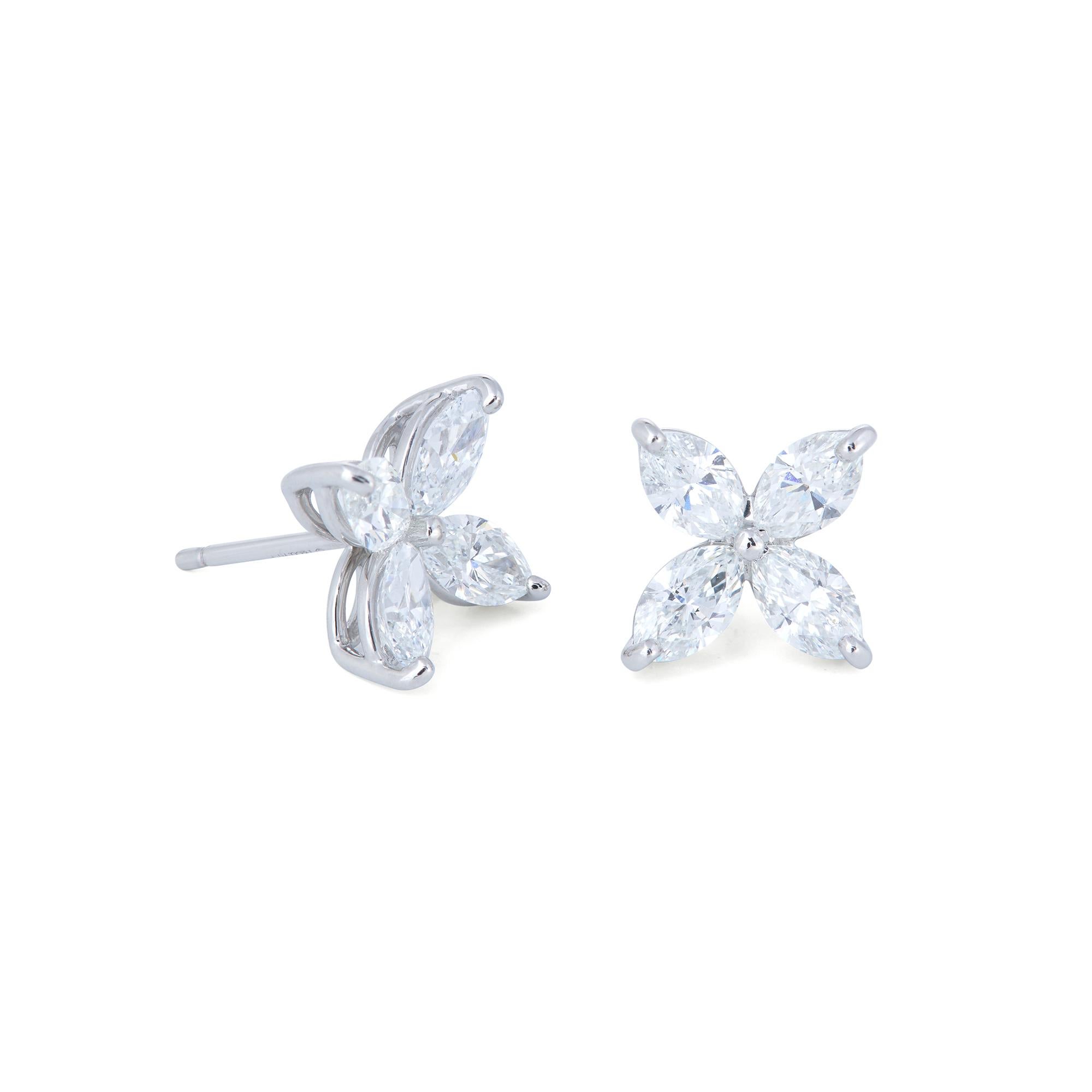 Authentic Tiffany & Co. 'Victoria' earrings crafted in platinum and set with sparkling marquise-shaped diamonds (E-F color, VS clarity) weighing an estimated 1.62 carats total weight. Signed Tiffany & Co., PT 950. The earrings are presented with the