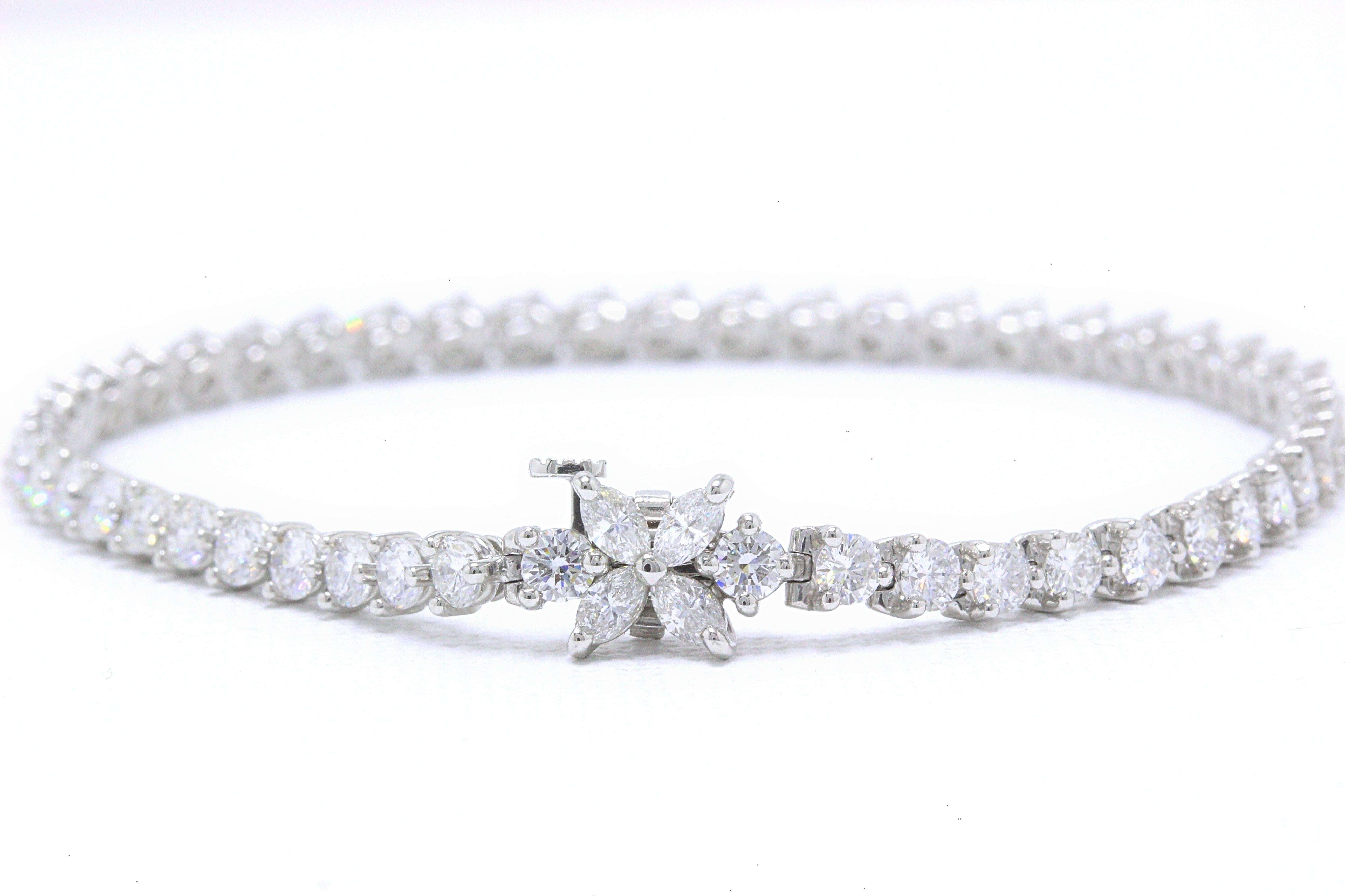 Tiffany & Co Victoria Line Diamond Bracelet in Platinum.  This Bracelet consists of 50 Round Brilliant Cut Diamonds weighing 3.85 TCW G - H color, VVS1 - VVS2 clarity with 4 Marquise Brilliant Cut Diamonds weighing 0.28 TCW G - H color, VVS1 - VVS2