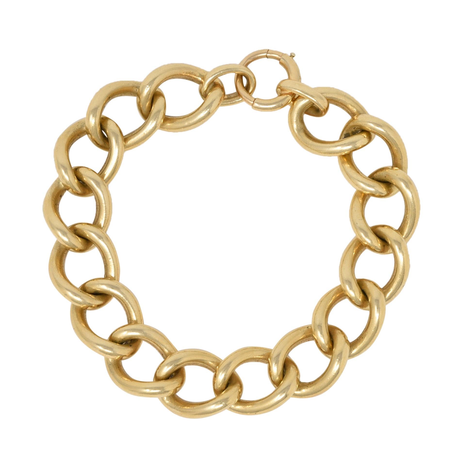 Designed as a curb link style chain 
Comprised of large oval links 
Completed by large spring clasp closure
Stamped for 14 karat gold 
Fully signed for Tiffany & Co.
Circa: 1890
Width: 1/2 inch
Bracelet size: 7 inch circumference with 3 inch