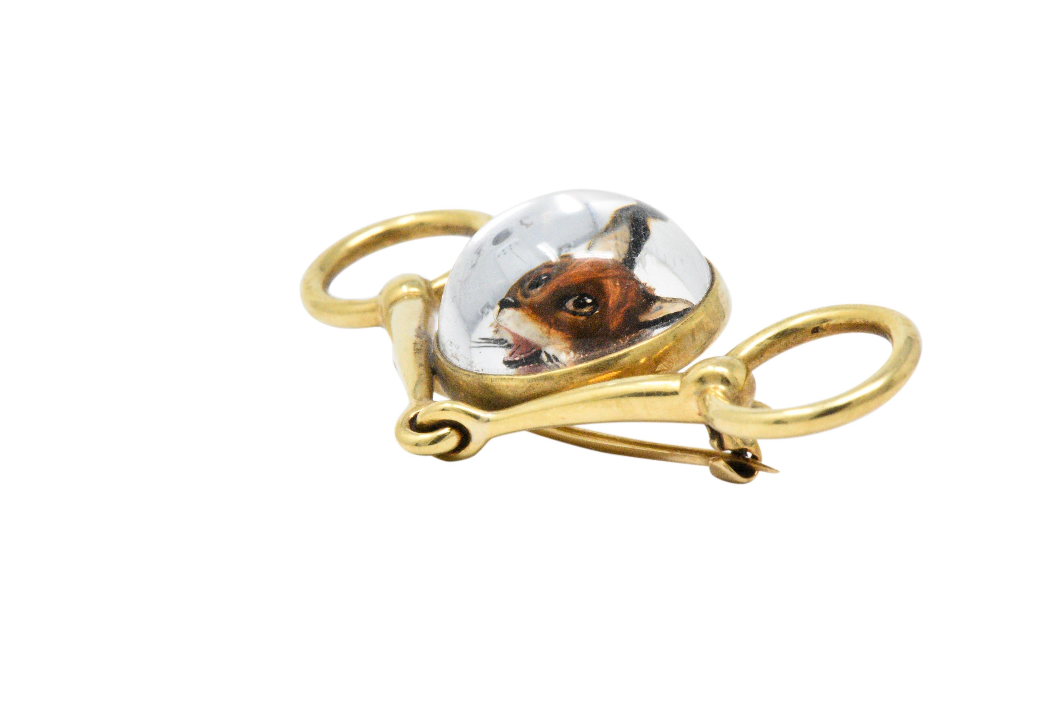 Round cabochon intaglio carved reversed painted crystal depicting the head of a fox backed with mother-of-pearl

Exquisitely detailed, with whiskers, an open mouth with a bright pink tongue and expressive eyes

Polished rich 14k yellow gold snaffle