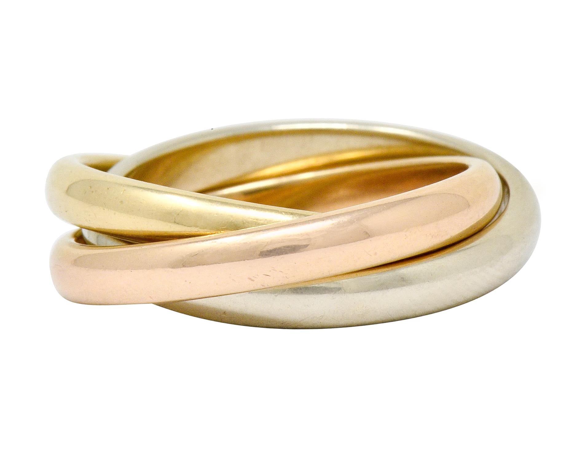 Designed as three interlocking band rings of yellow, rose and white gold

Fully signed Tiffany & Co.

Stamped 585 for 14 karat gold

Inspired by Paloma's Melody collection

Circa: 1990s

Ring Size: 6 & not sizable

Width measures: approximately 5.8