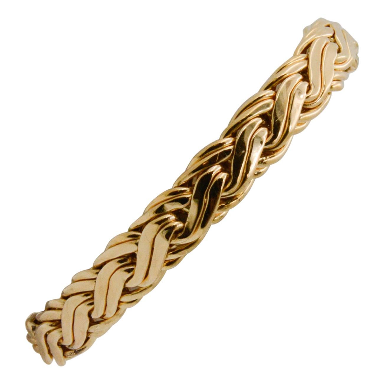 This Tiffany & Co. 14k yellow gold bracelet dates back to the 1940s. It has an elegant Byzantine a pattern and measured 9.6mm wide and 7.5