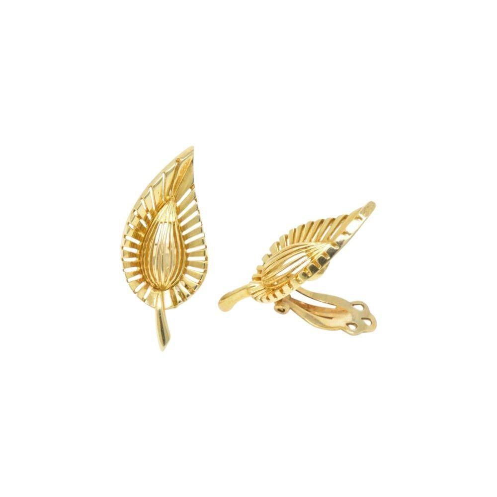 A stunning pair of earrings from Tiffany & Co. Featuring a pair of vintage Leaf Ear Clips, these earrings showcase Tiffany's love for beauty and subtle sophistication. The earrings are 14K yellow gold and measure 1 1/4