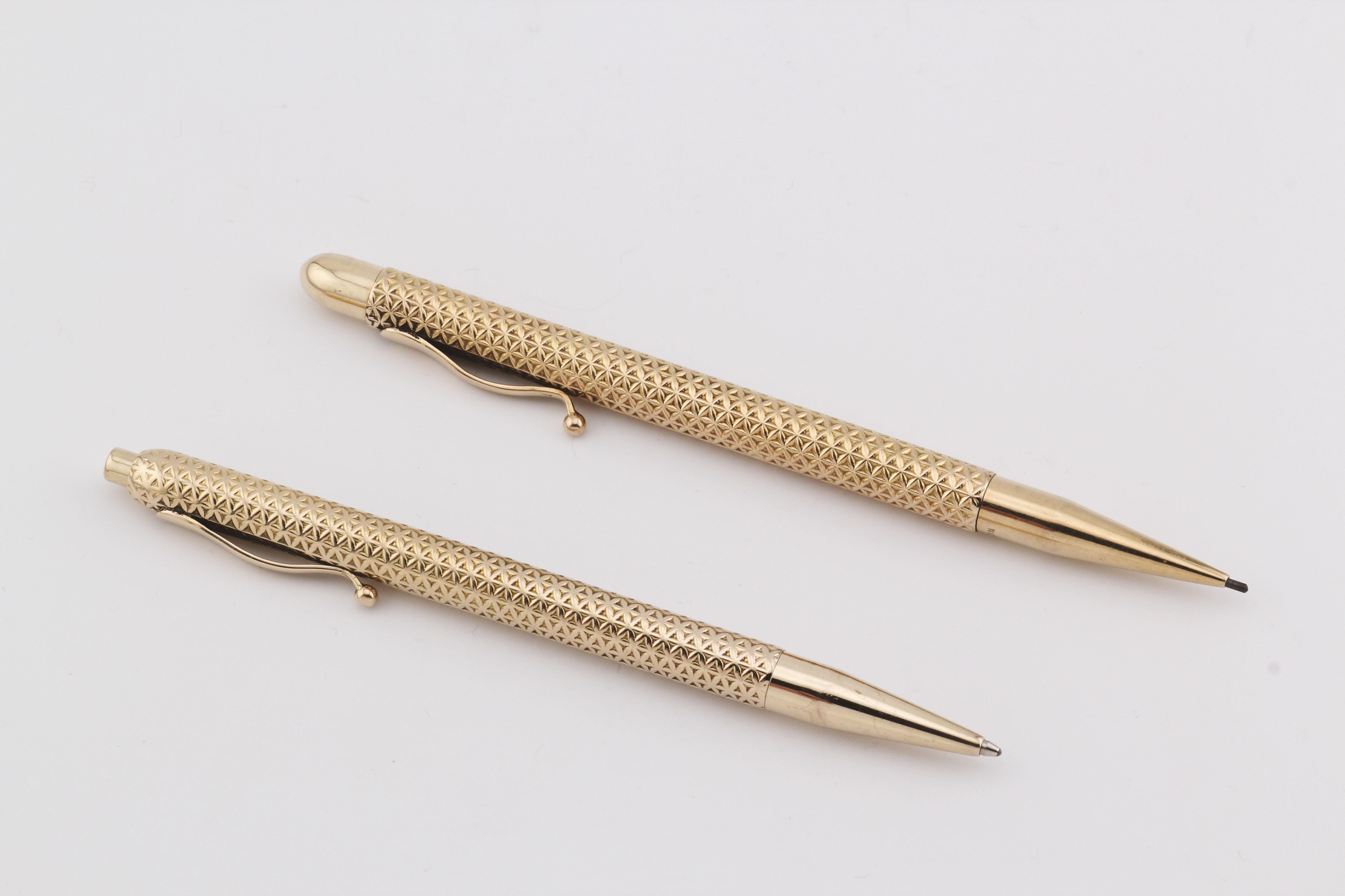 Exude timeless sophistication with this Tiffany & Co. Vintage 14K Yellow Gold Ballpoint Pen (blue ink) and Pencil Set, a masterful blend of luxury, elegance, and functionality. Crafted from solid 14K yellow gold, this set embodies the classic