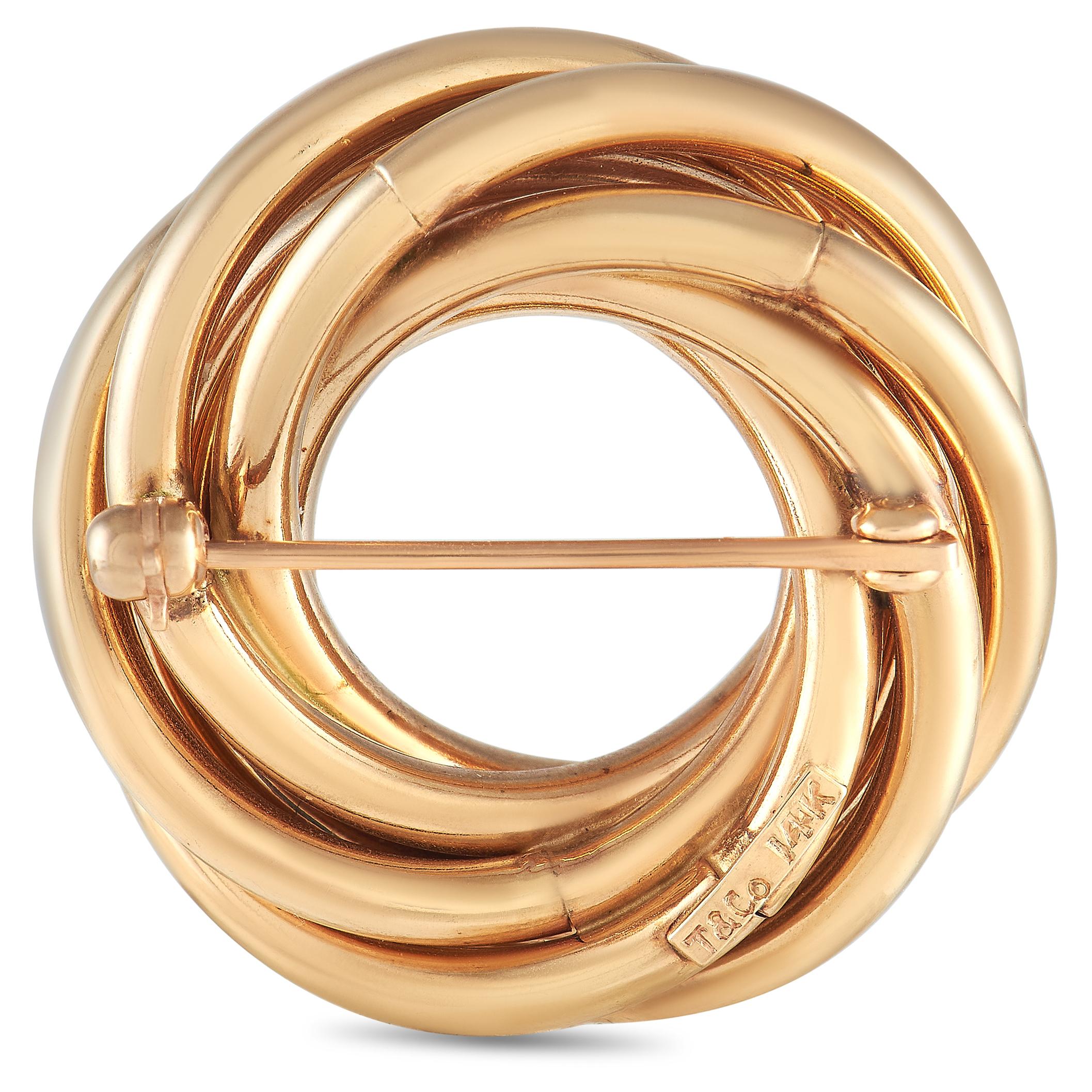 Add an elegant adornment to your dressy outfits in the form of this golden brooch from Tiffany & Co. This versatile accessory features a spiral ring shape in polished 18K yellow gold. Count on this classy piece to bring a touch of of unexpected