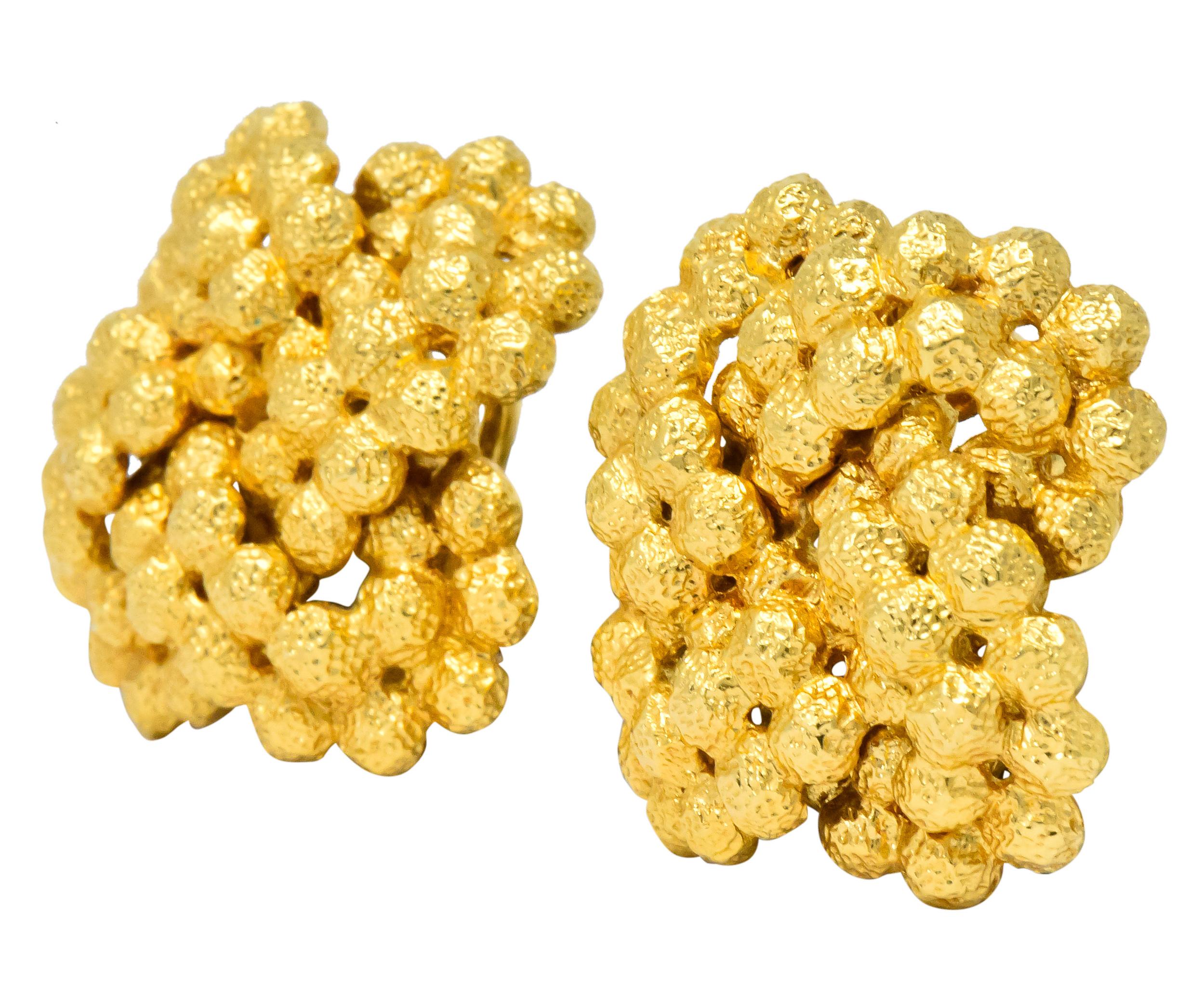 Gold, dimpled bead cluster earrings

Completed with omega hinged clip backs

Fully signed Tiffany & Co.

Stamped Italy and 18kt

Measures: 7/8 inch

Total weight: 15.4 grams

Textured. Lustrous. Bold.
 

 

Stock Number: We-2867