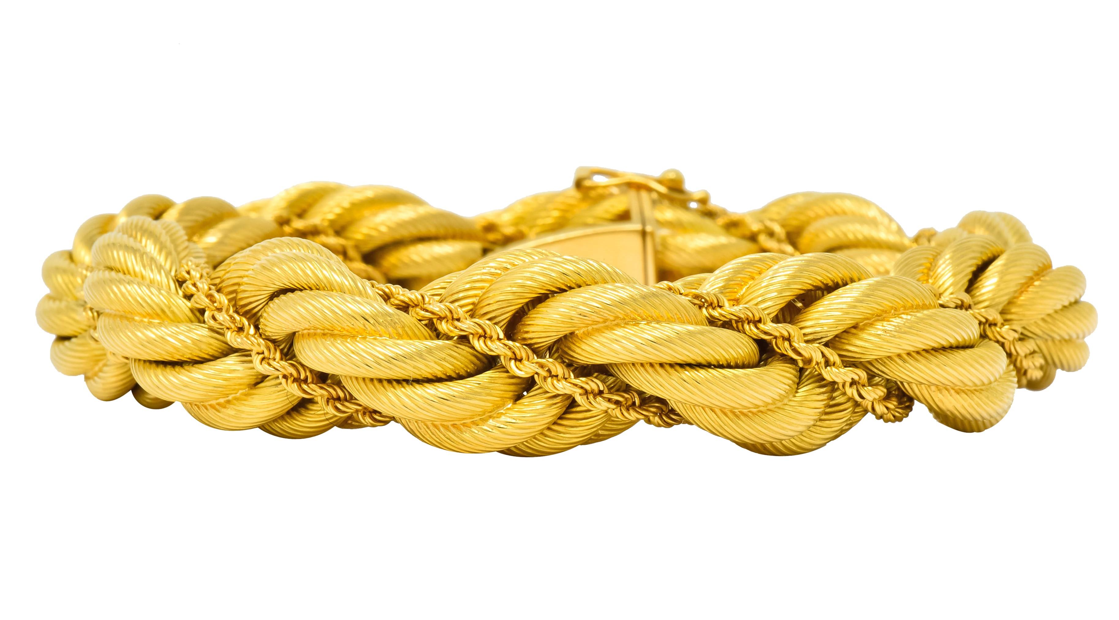 Bracelet designed as a large twisted rope motif depicting a ridged texture
Intertwined with a small rope chain

Completed by a concealed clasp with two figure eight safeties

Fully signed Tiffany & Co. Italy and stamped 18k for 18 karat gold

Circa