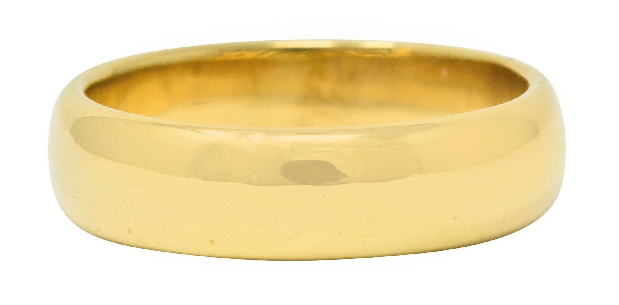 Wide band ring with a rounded curvature

Finished by a high polish

Fully signed Tiffany & Co.

Stamped Au750 for 18 karat gold

Circa: 1990s

Ring Size: 9 1/4 & sizable

Measures: 5.9 mm wide and sits 1.8 mm high

Total weight: 9.3 grams

Classic.
