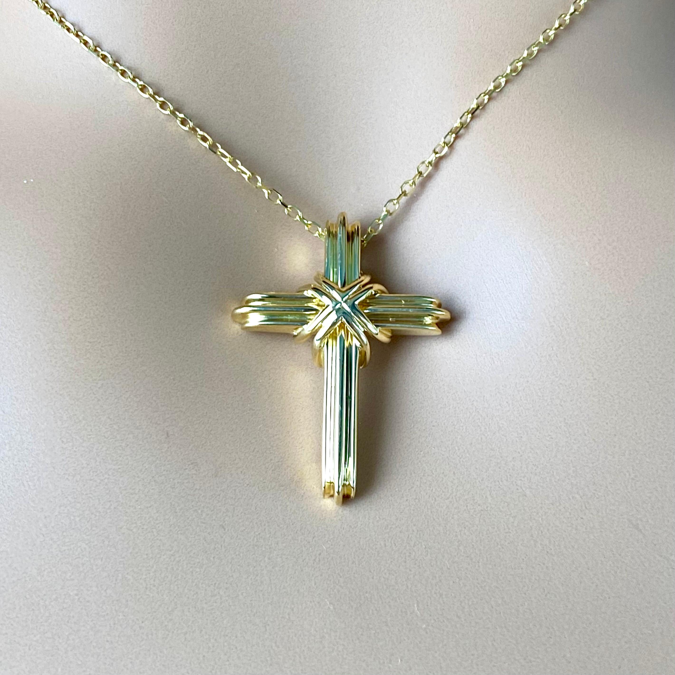 Introducing a timeless symbol of faith and elegance – the Tiffany & Co 18k Gold Cross Pendant. Crafted with precision and marked with the distinctive 