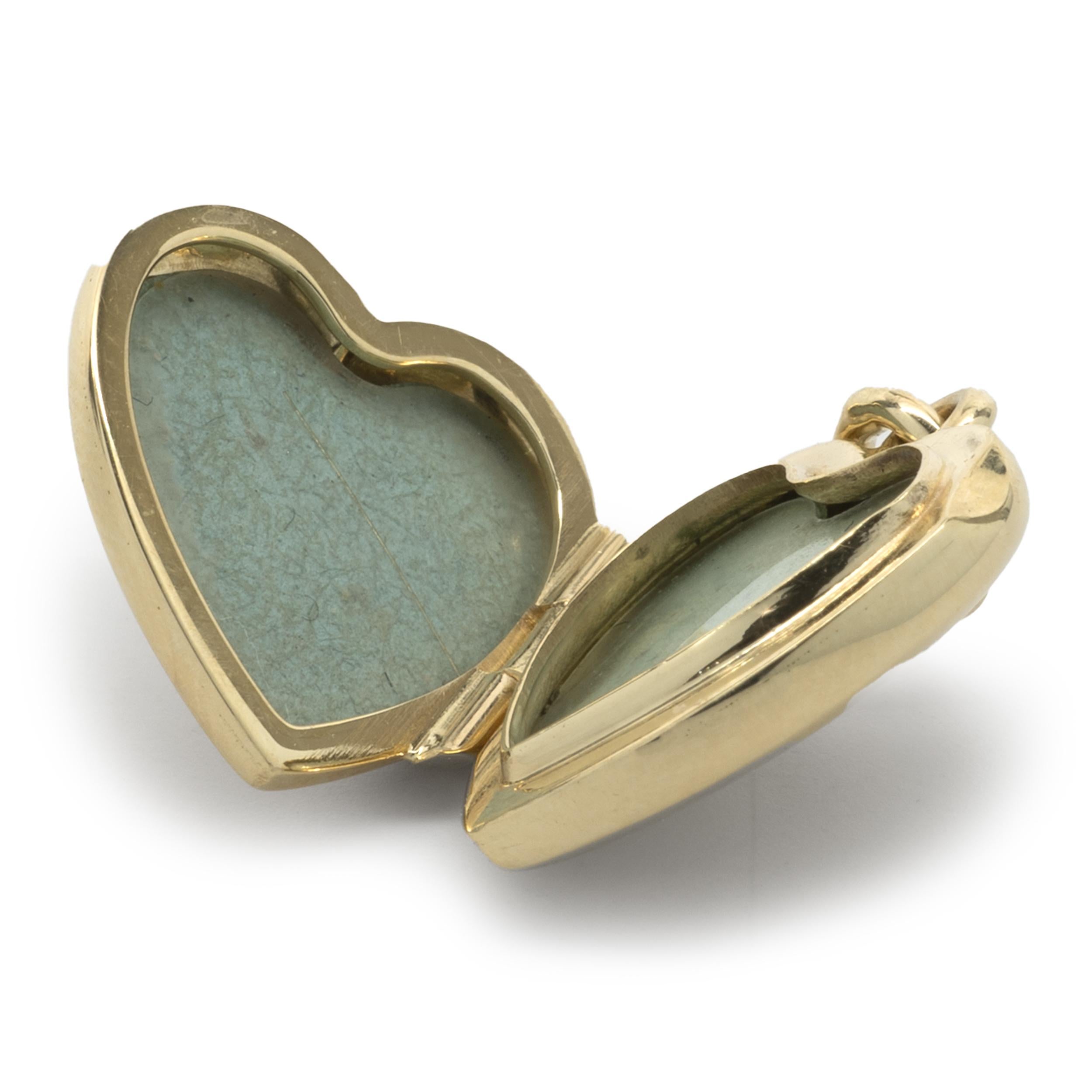 Designer: Tiffany & Co. 
Material: 18K yellow gold
Dimensions: locket measures 24 X 16.5mm
Weight: 5.24 grams
