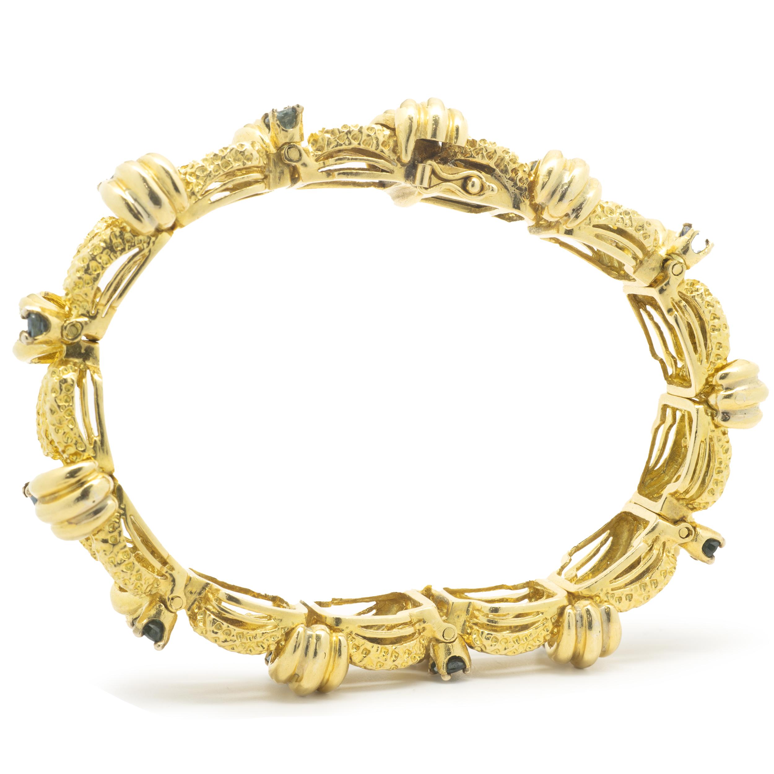Designer: Tiffany & Co. 
Material: 18K yellow gold
Sapphire: 12 oval cut = 1.92cttw
Dimensions: bracelet measure 7-inches long, 13mm wide
Weight: 59.48 grams
