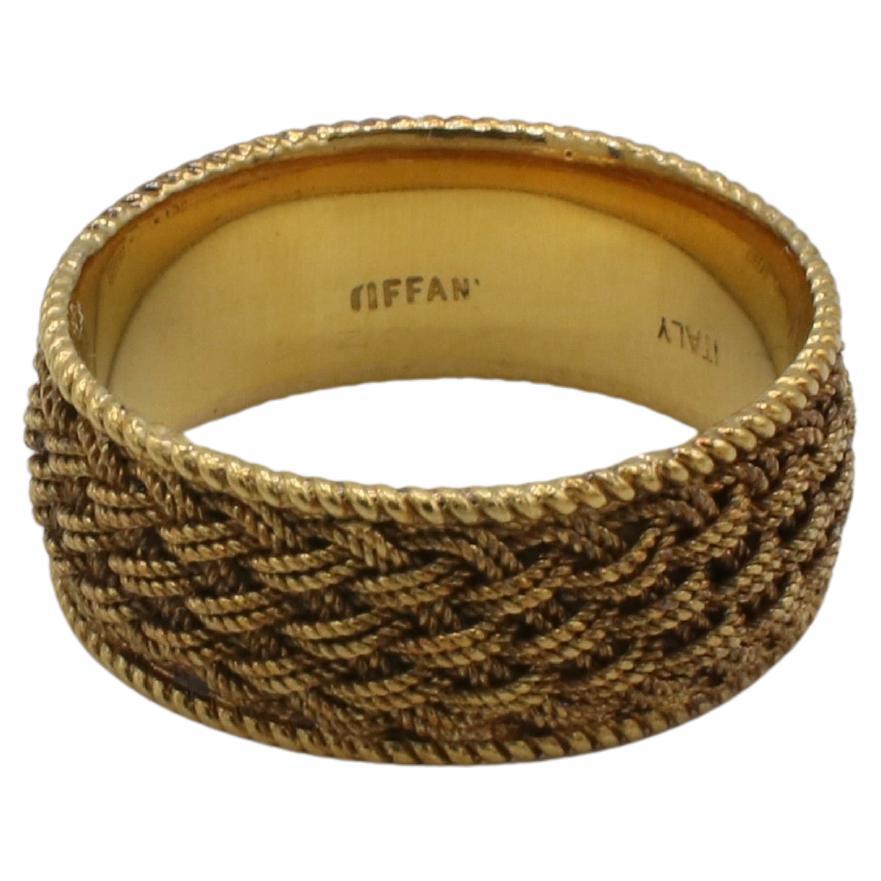 Tiffany & Co. Vintage 18 Karat Yellow Gold Woven Mesh Wide Band Ring 
Metal: 18 Karat yellow gold
Weight: 5.34 grams
Size: 7.5 (US)
Width: 7.7mm
Signed: Tiffany 18K Italy 
LDD F35000554