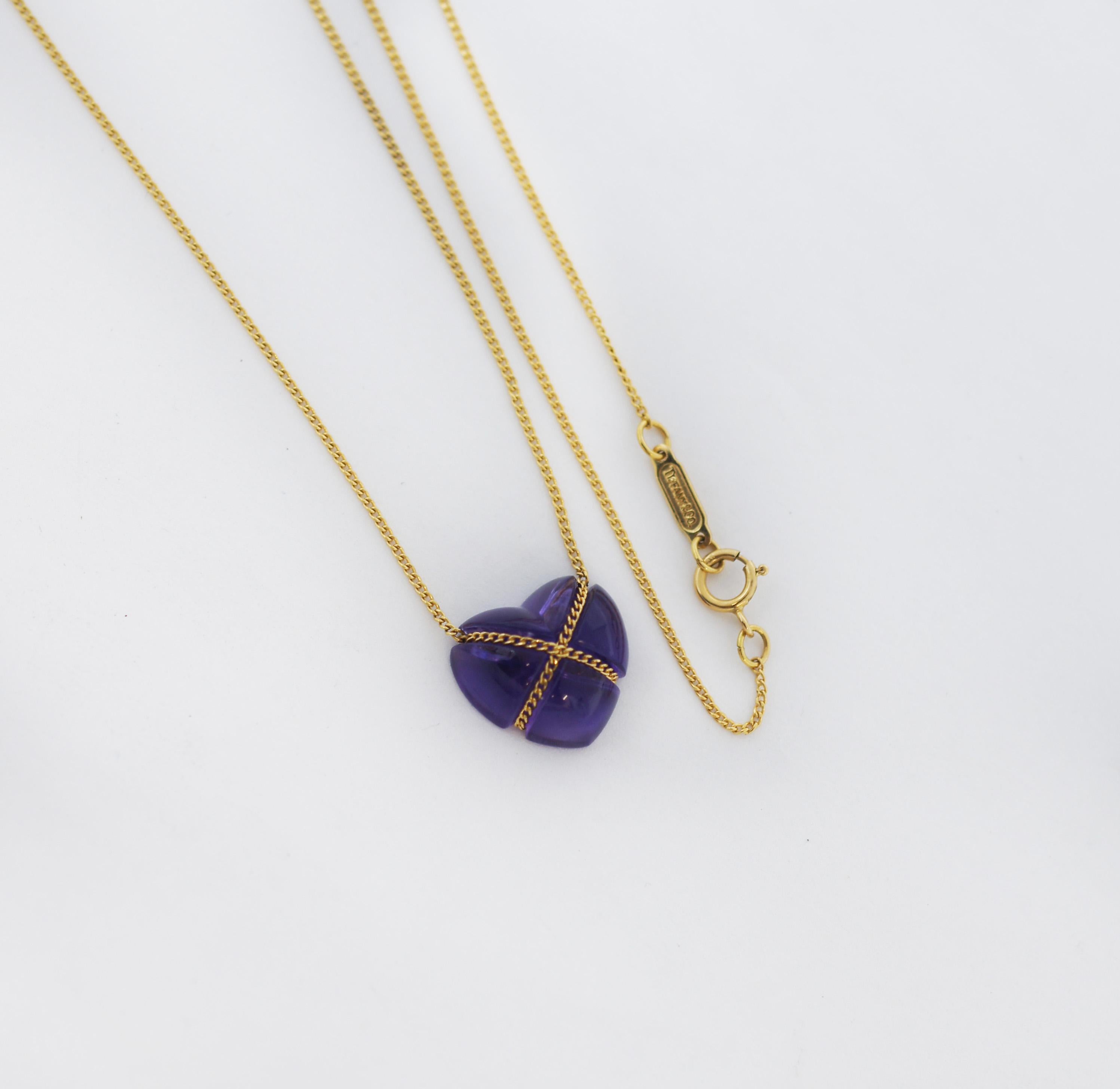 Tiffany & Co.
Vintage Cross My Hear Necklace
Classic curb chain necklace centers an amethyst heart cabochon
Bright purple and translucent with natural inclusions
Tightly wrapped with curb chain in an X motif
Necklace completes with a spring ring