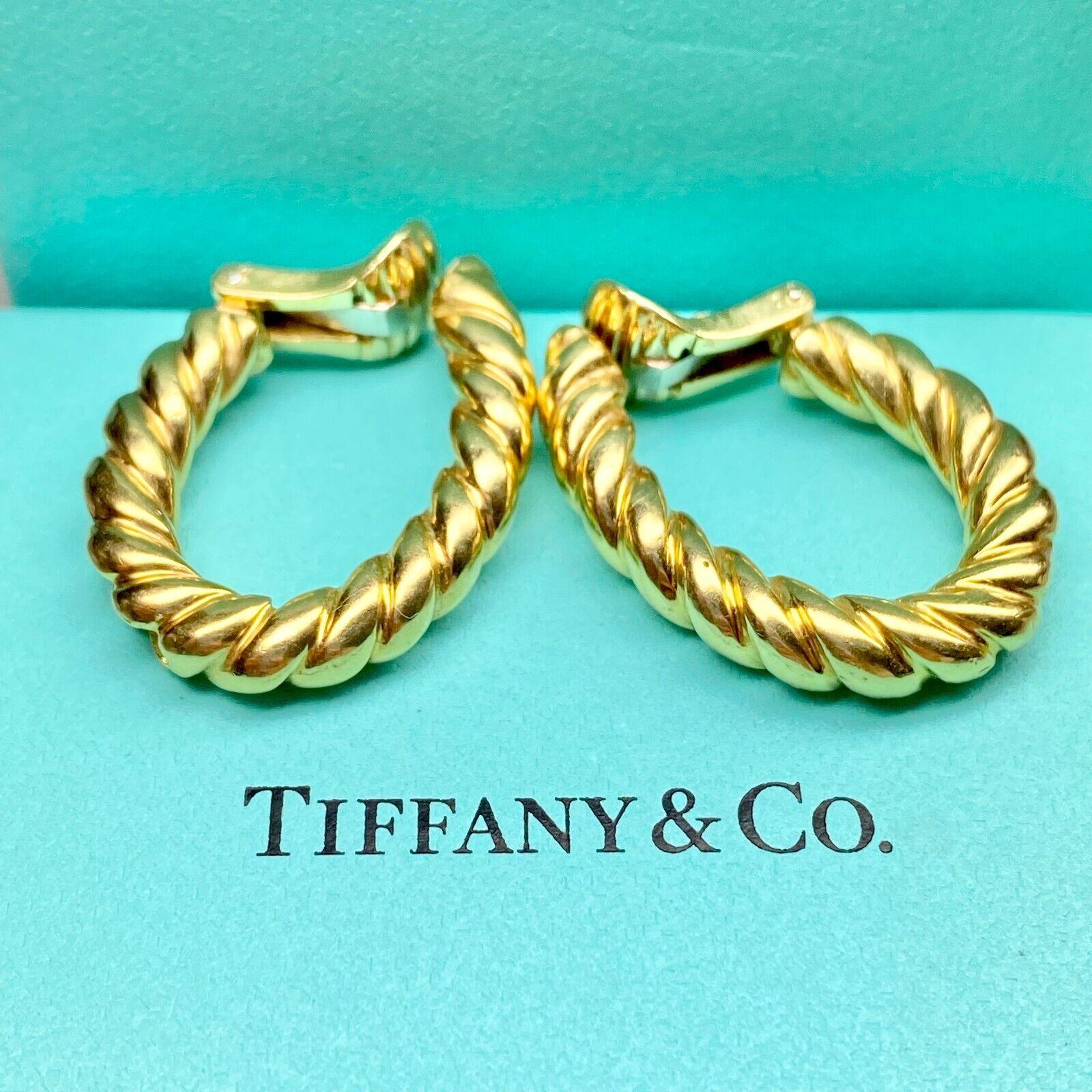     brand: UNBRANDED
    metal: 18K YELLOW GOLD
    type: CLIP EARRINGS
    weight: 17.53 GRS 
    haLLMARK:  TIFFANY &CO 18K
