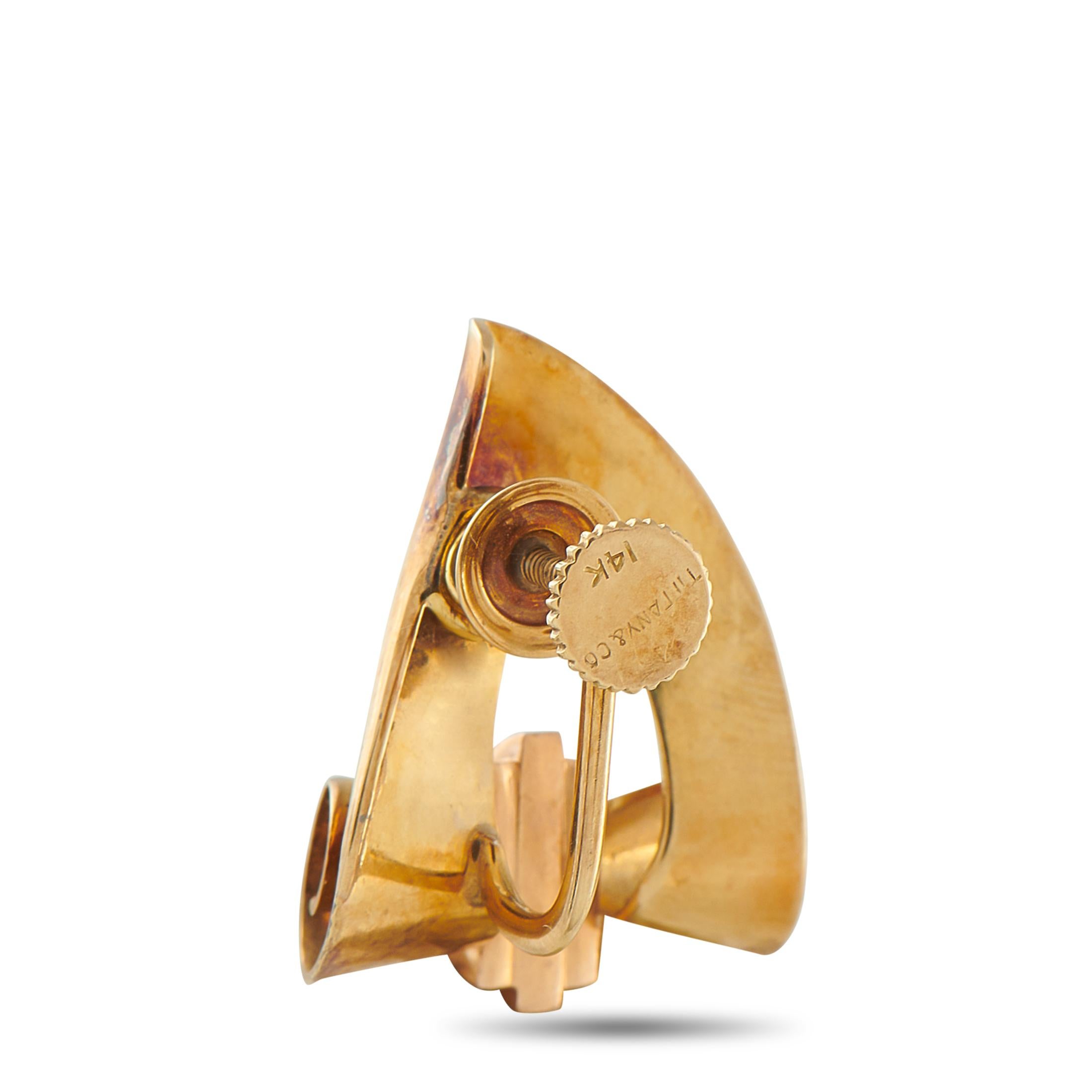 These Vintage Tiffany & Co. earrings will continually impress. A detailed scroll motif accents the triangular 18K Yellow Gold settings, which feature curved lines for added elegance and movement. Ideal for anyone who appreciates jewelry with old