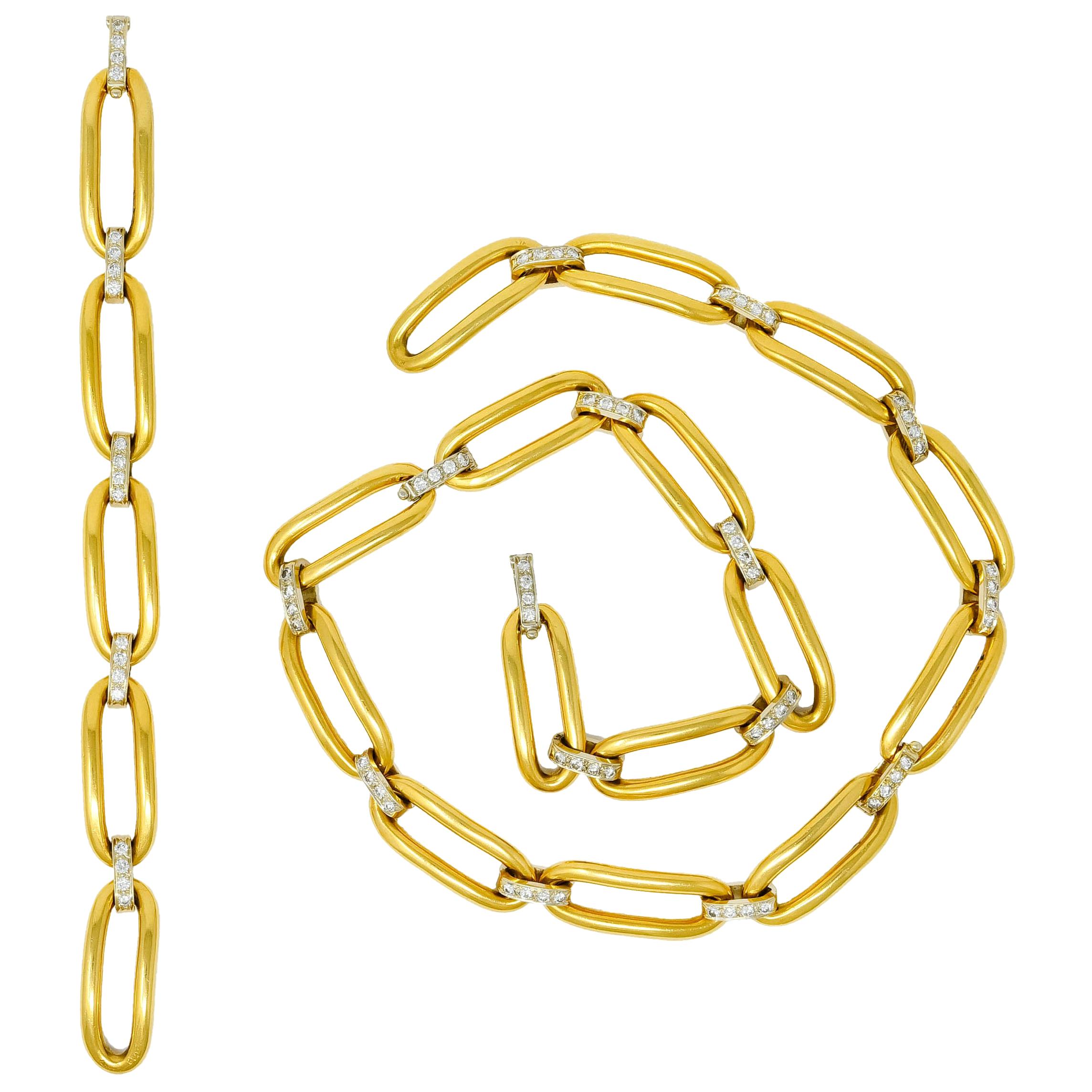 Link style necklace and matching bracelet comprised of large, elongated, yellow gold links alternating with white gold spacer links

Spacer links are bead set with round brilliant cut diamonds weighing approximately 4.56 carats, F/G color and VS