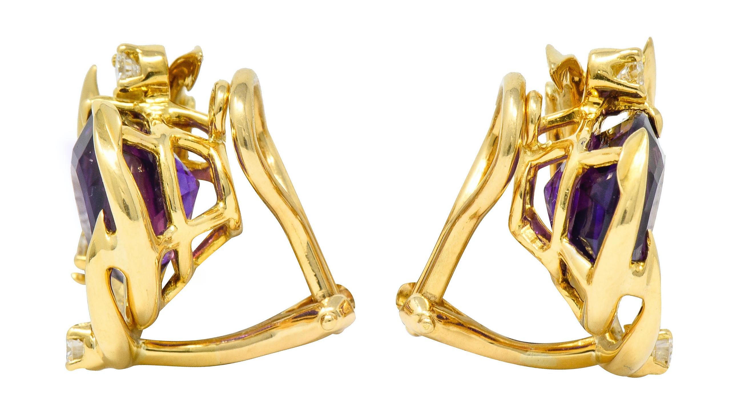 Earrings each center a 10.0 mm round cut amethyst; very well-matched and medium-dark purple in color

With vine-like polished gold segments as a partial surround

Accented by round brilliant cut diamonds weighing in total approximately 0.36 carat;