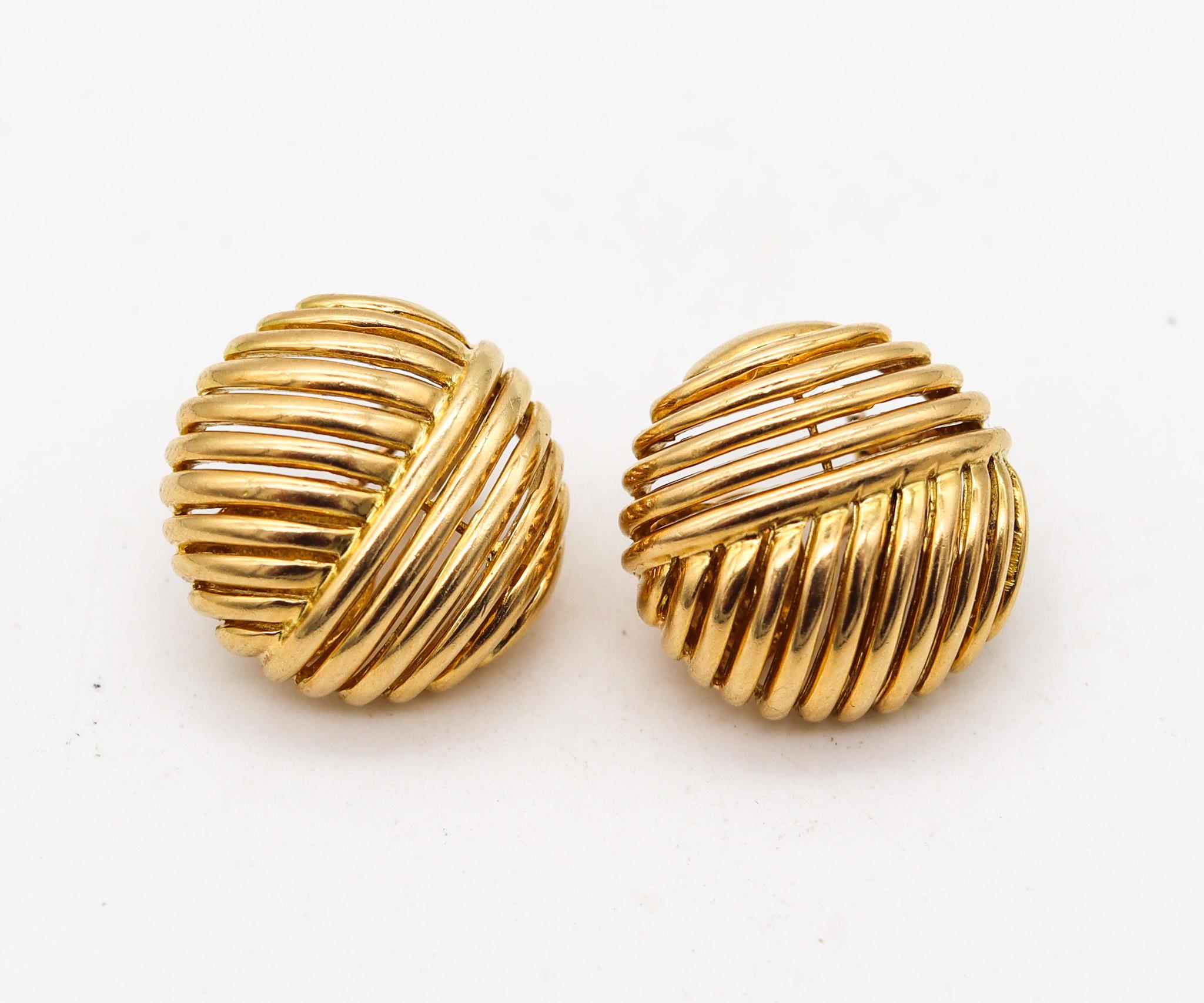 Pair of buttons earrings designed by Tiffany & Co.

Beautiful every day pair of clips earrings, created at the Tiffany Studios, back in the 1980. Crafted with a bombe geometric patterns in solid yellow gold of 18 karats with polished finish. They