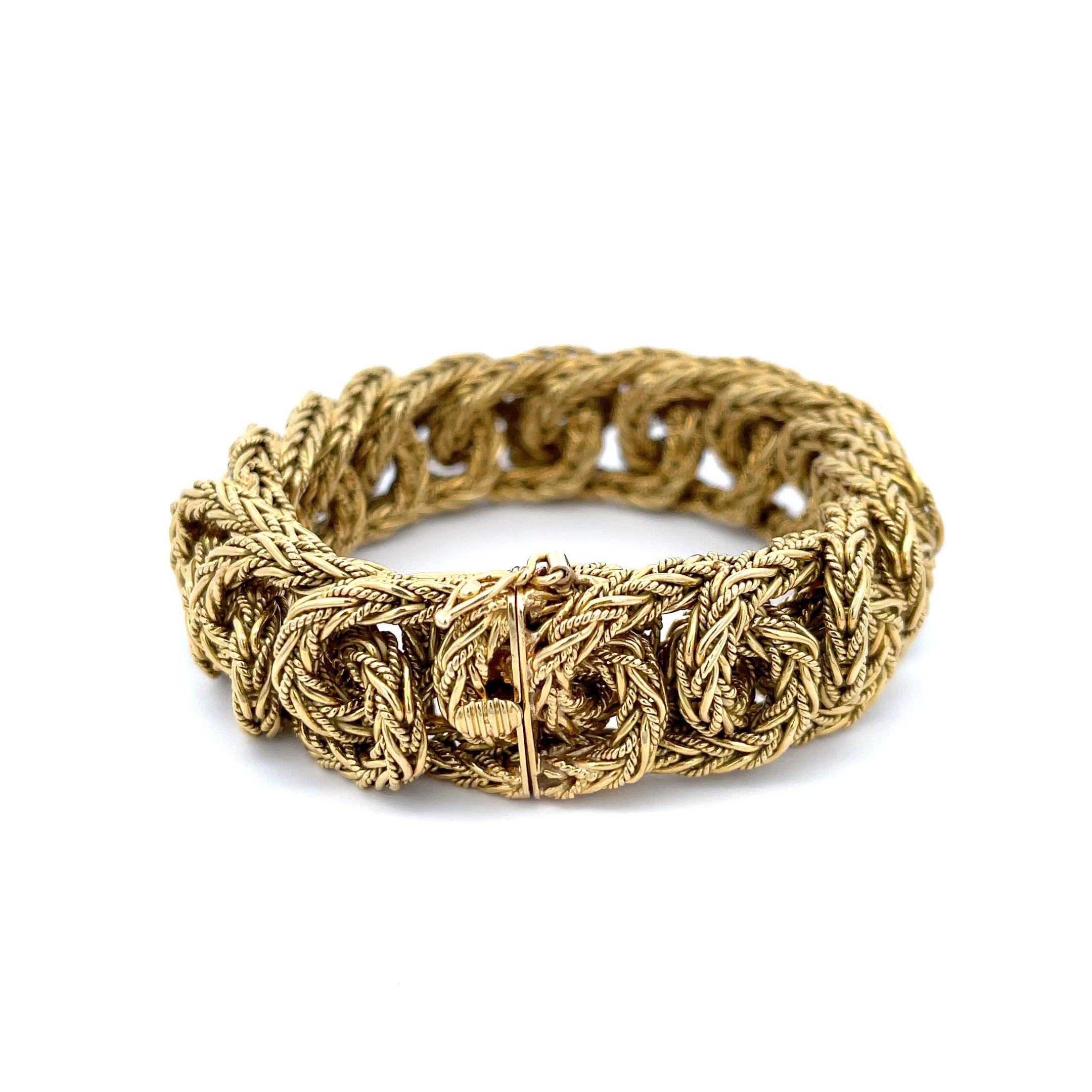 Estate Tiffany & Co. Vintage Braided Link Bracelet in 18K Yellow Gold. This rare bracelet features a hidden claps with a figure eight safety latch, is 7 3/8