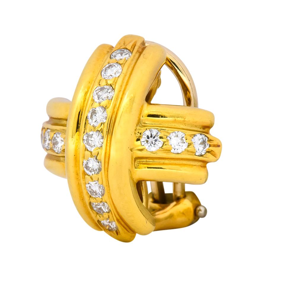 Each designed as a cross motif with ribbed polished gold

Bead set with round brilliant cut diamonds weighing approximately 0.60 carat total, F/G color and VS clarity

Completed by hinged omega clip-backs

From Tiffany & Co.'s 1992 Signature X