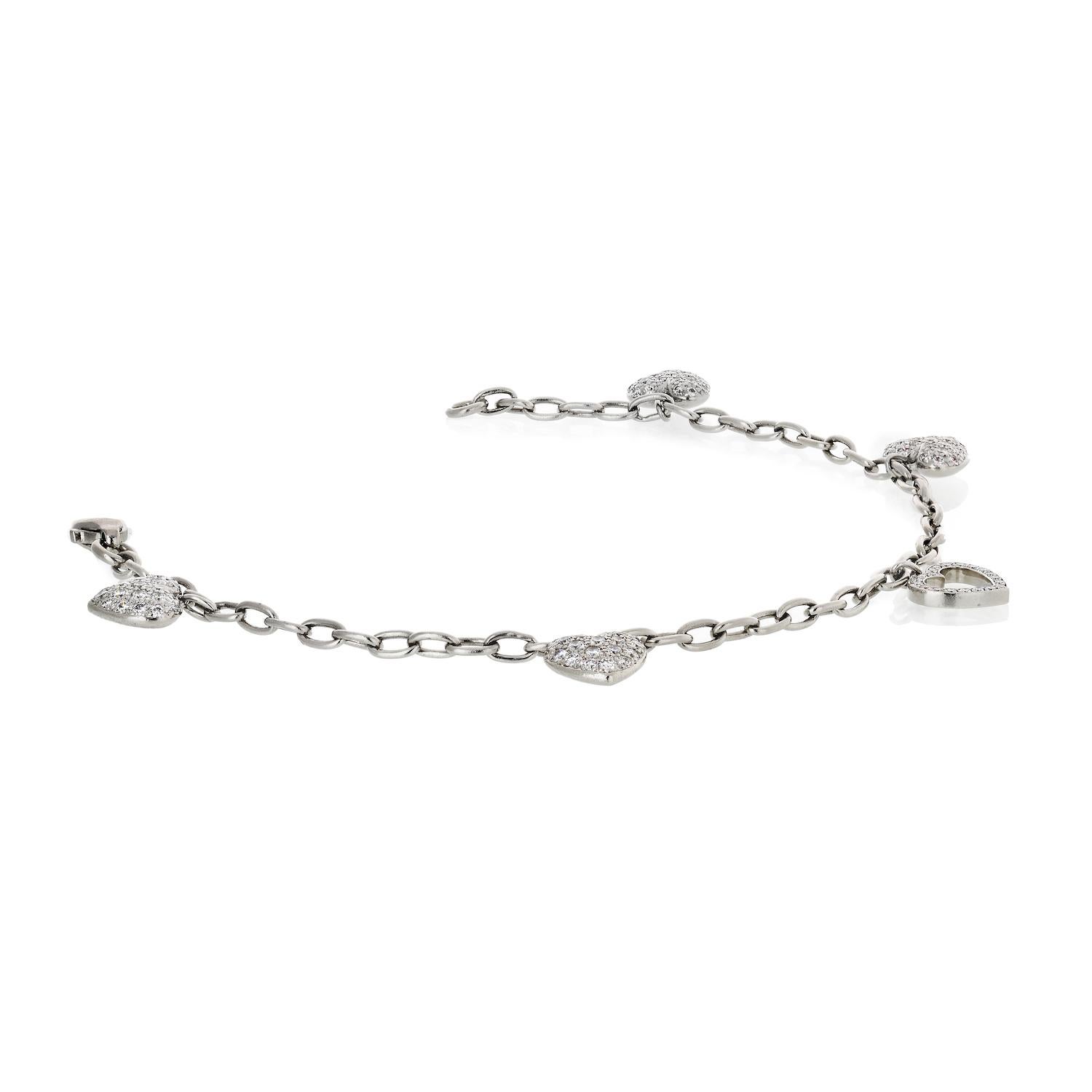 Lovely and cute charm bracelet created by Tiffany & Co. in France in 2003. 

Feminine, delicate and wearable, the bracelet is a great addition to your jewelry collection and perfect gift.

The bracelet and the charms are made of platinum, the charms