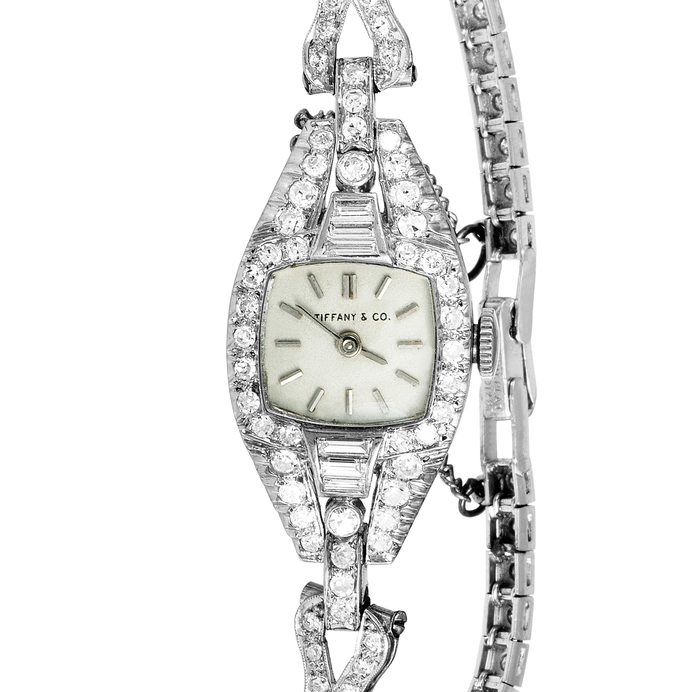 Glamorously designed and stunningly decorated, this stylish vintage watch is an exquisite create of Tiffany & Co. The beautiful watch is set with 1.75 carats of sparkling diamonds and made of platinum.