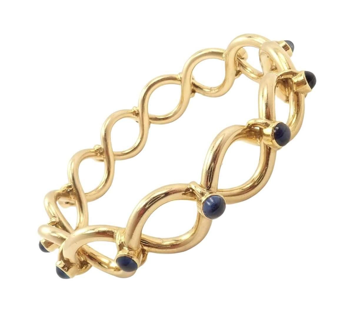 This is a Rare & Vintage Tiffany & Co. 18k Yellow Gold Blue Sapphire Bangle Bracelet. 
This Tiffany Bracelet was Made in France.
Metal: 18k Yellow Gold
Length: 7.25