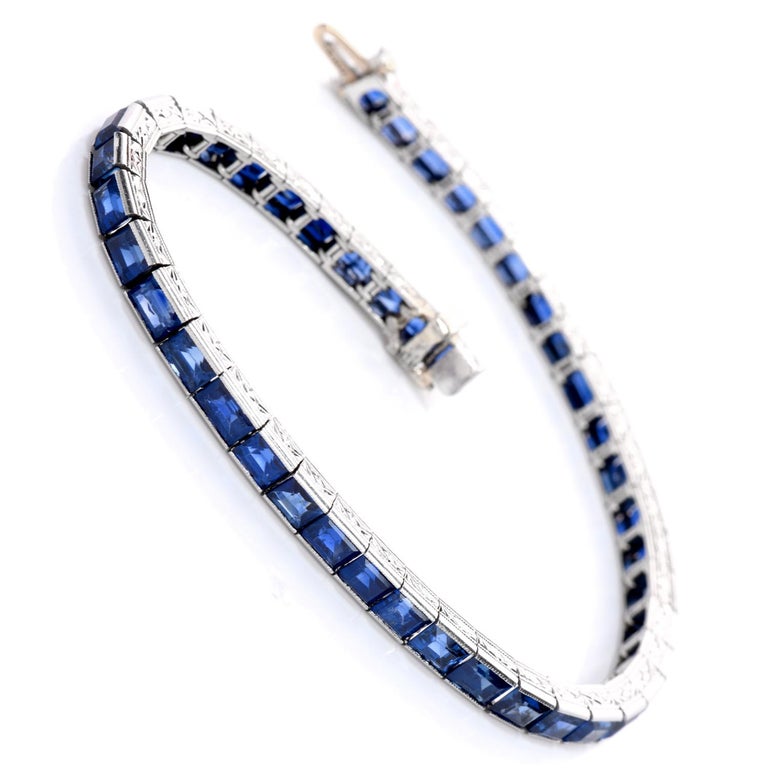 Fall head-over-heels for this ravishing Tiffany & Co GIA Blue Sapphire Platinum Tennis Line Bracelet! 

Forty-five Royal blue, no heat, step cut sapphires create this exquisite classic Tiffany & Co. designer bracelet. 

Tennis bracelets compliment