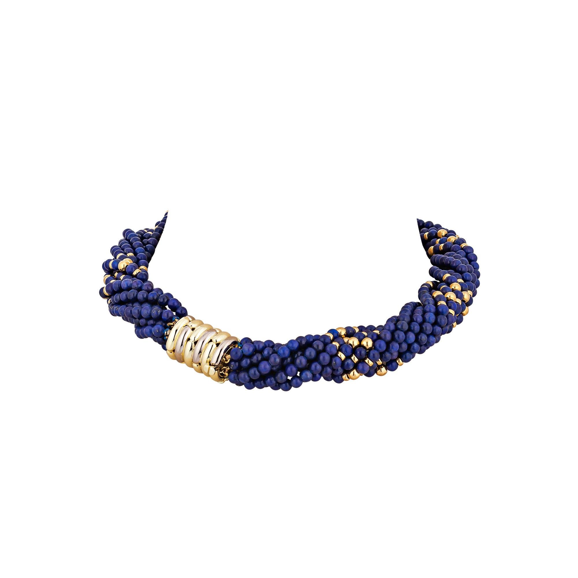 Like stars in the night, the 18 karat gold beads in this Tiffany & Co. vintage necklace mix magically with the deeply luscious midnight blue lapis beads creating this colorful one-of-a-kind choker necklace.  Ribbed 18 karat yellow gold closure is