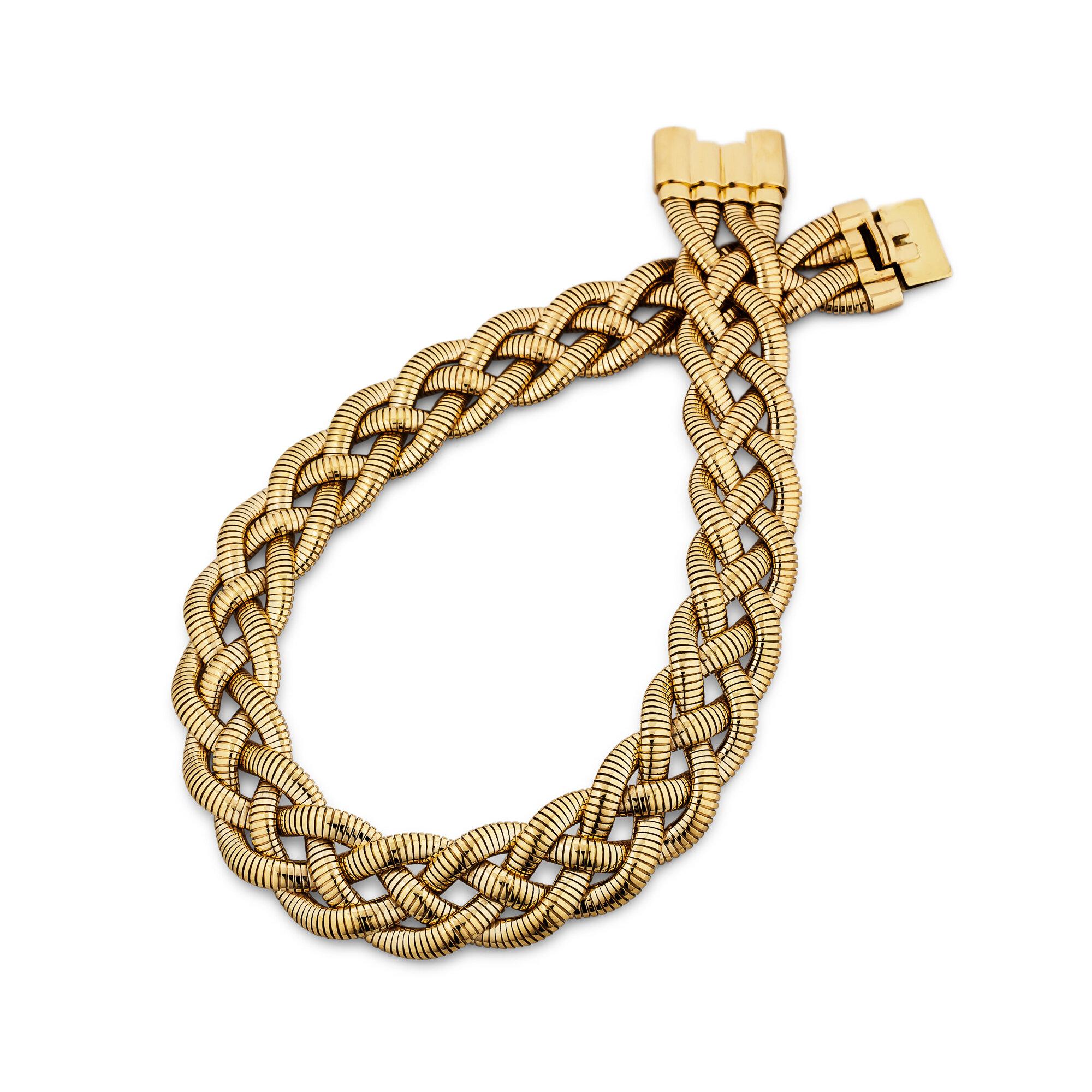 A Tiffany & Co. vintage 14 karat yellow gold braided tubogas necklace will add the perfect amount of visual texture, modern style, and richness to everyday wear.  Flexible and comfortable to wear.  Signed Tiffany & Co.  Circa 1980's.  16