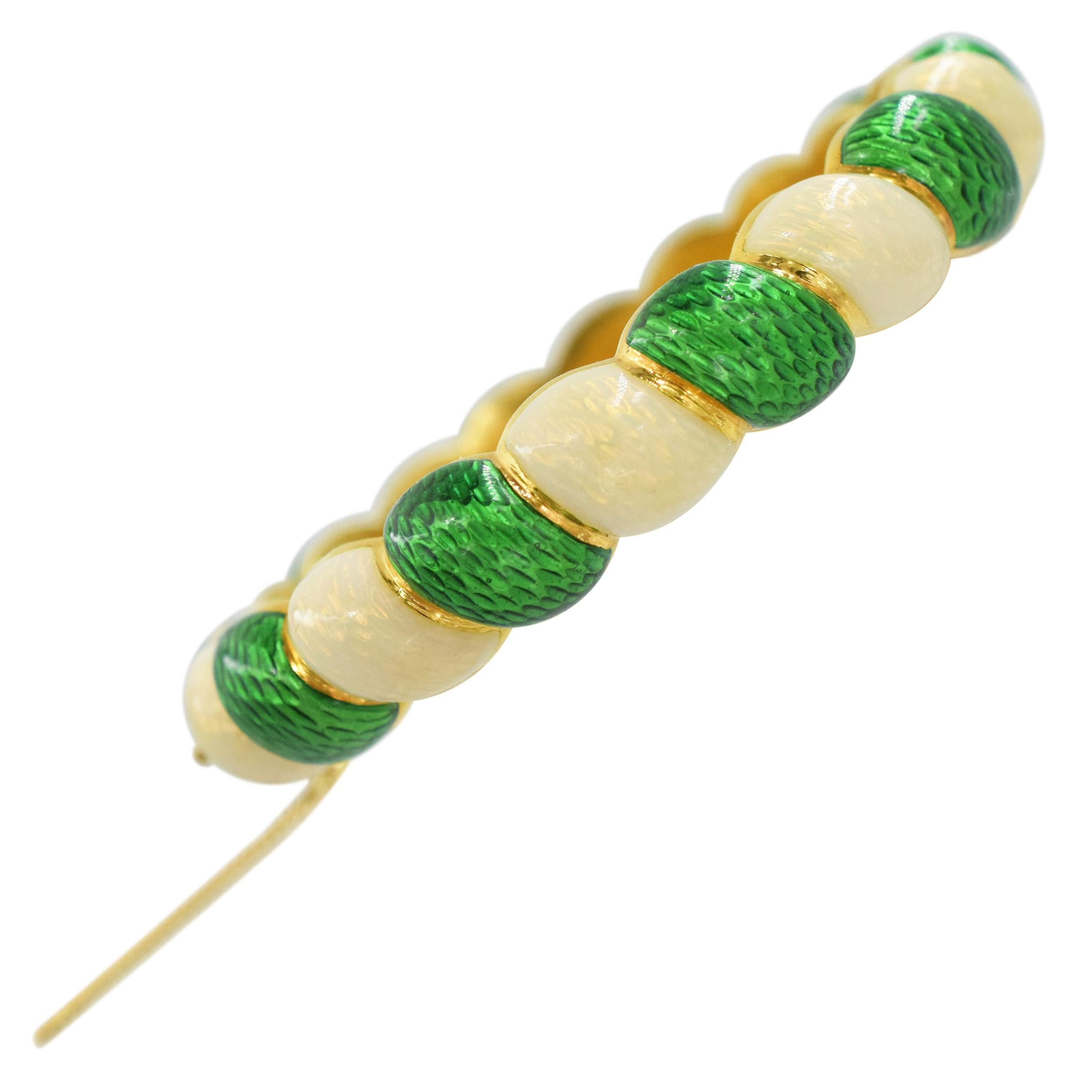 Vintage Tiffany & Co. Green and white enamel bracelet crafted in 18K Yellow
Gold. The bracelet features twist design, alternating white and green enamel covered strands. Equipped with the hinge, box clasp, and safety chain. Inscribed:
Tiffany&Co,