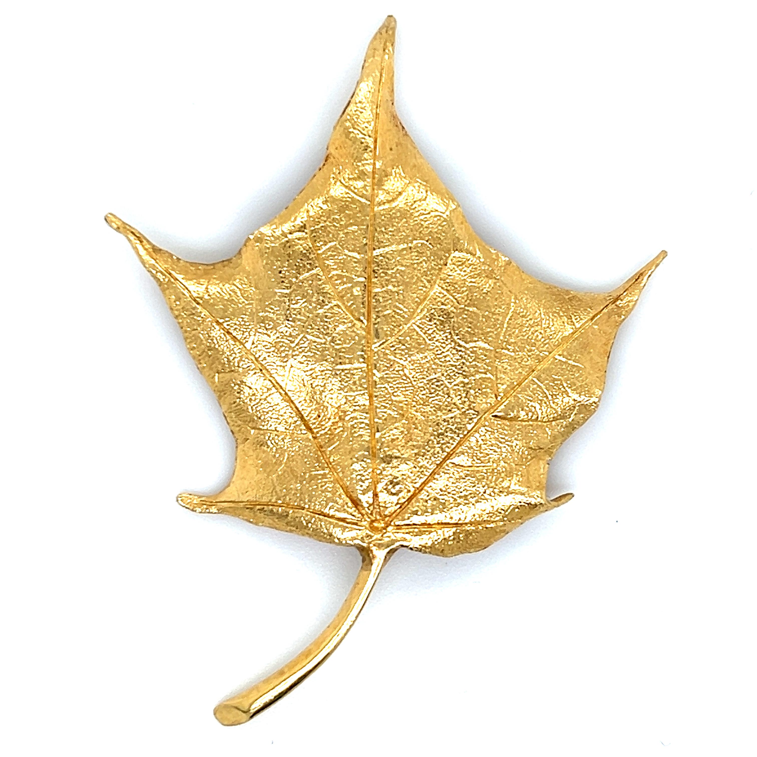 Beautiful design by famed designer Tiffany & Co. The brooch is crafted in 14k yellow gold and shows exquisite detail. Simple & elegant the brooch depicts a golden maple leaf and is sure to be complimented whenever worn. The brooch measures 2.25