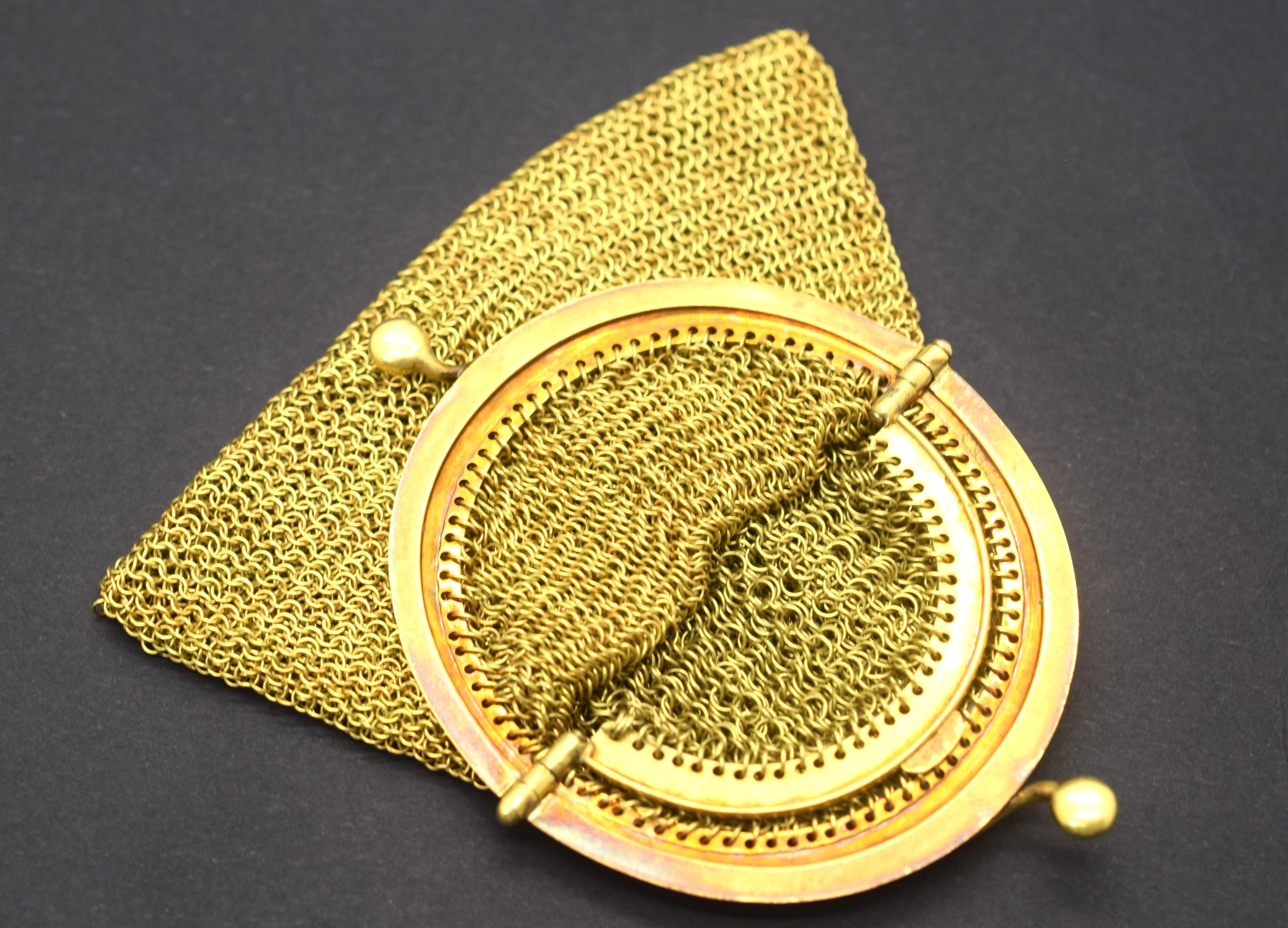 Gorgeous Tiffany & Co. vintage mesh purse crafted in 18k yellow gold. This unique item is truly one of a kind. The purse is crafted out of solid 18k yellow gold. The purse has a hinge opening with a dual separated compartment inside. The condition