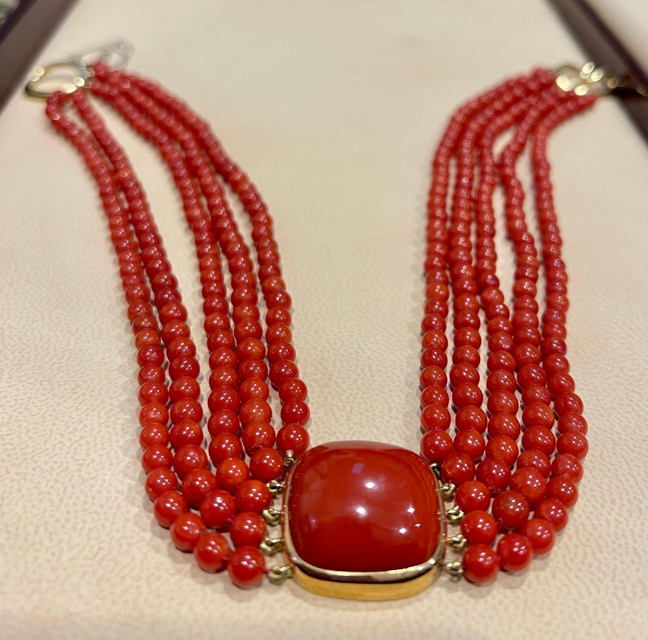 Tiffany & CO, Vintage Natural Coral Multi Layer Bead Necklace Coral Pendant 18 Karat yellow gold 
Marker Tiffany & CO
A vintage piece.
Weight 52.2 Gram 
Vintage 13 inch Choker 
5 lines of beads , very very uniform beads in shape size and color.