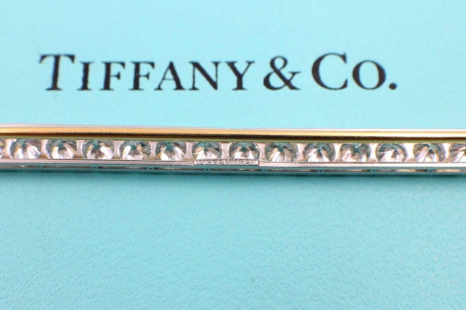 Tiffany & Co 

Vintage Old European Cut Diamond Brooch Pin containing 
18 Stones ....4.60 TCW F - G color, VS1 - VS2 clarity.  
Set with 18K Yellow Gold and Platinum.  
Dimensions are 3.80 - 4.00 x 2.40 MM.  
Hallmarked 