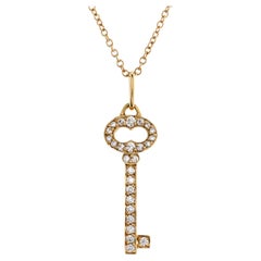 Tiffany & Co. Vintage Oval Key Pendant Necklace 18k Yellow Gold with Diamonds