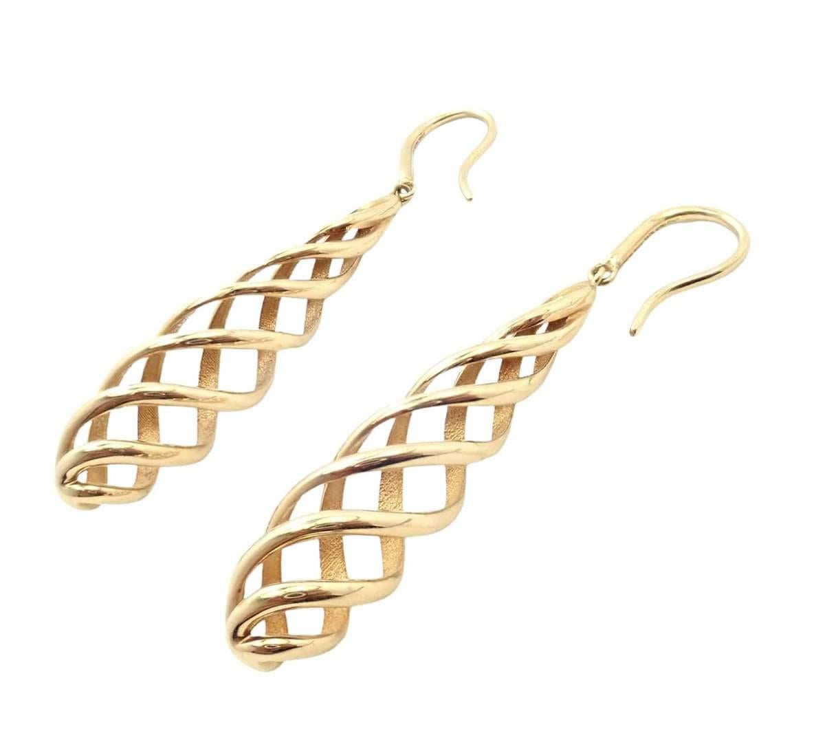 18k Yellow Gold Vintage Spiral Shell Earrings by Paloma Picasso made for Tiffany & Co.
These earrings were Made in Italy. 
Metal: 18k Yellow Gold
Size: 10mm x 55mm
Weight: 9.6 grams
Design: Paloma Picasso
Stamped Hallmarks: Tiffany & Co au750 Paloma