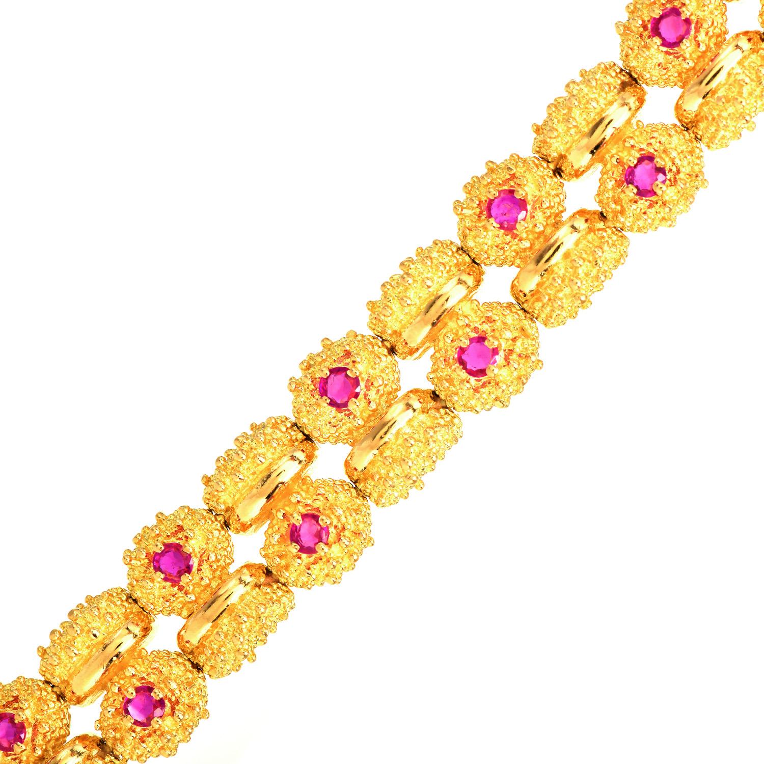 Decorate your wrist extravagantly with this impressive Vintage Tiffany & Co. Bead Textured Link Double Bracelet.

Crafted in solid 18K yellow gold and has (22) Genuine Red-Pink Rubies, Round Cut, Prong-set, weighing collectively  1.70  carats.

They