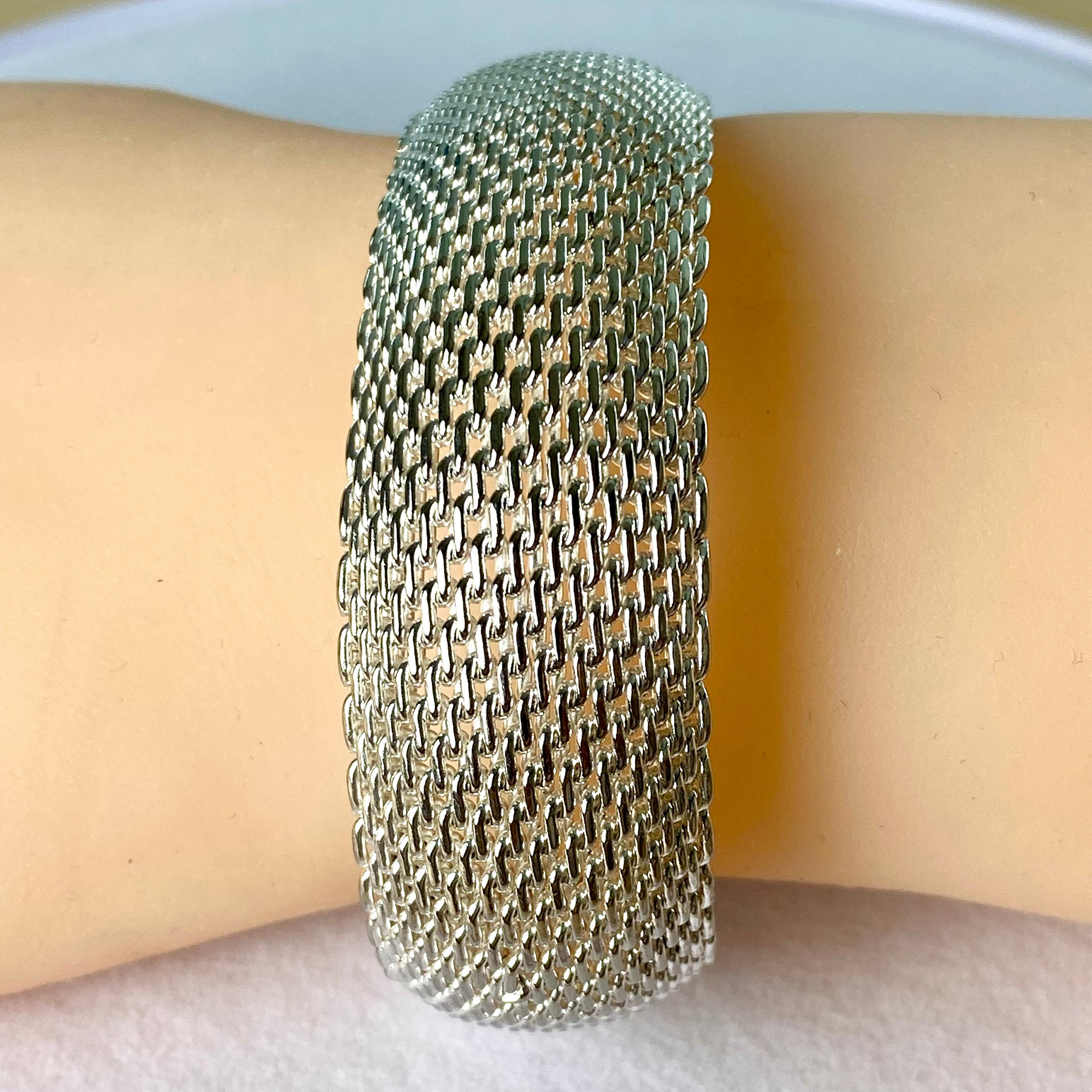 Introducing the timeless elegance of the Tiffany & Co. Vintage Somerset Mesh Weave Flexible Bangle Bracelet, a classic piece that exudes sophistication and craftsmanship. This exquisite bracelet is hallmarked with the prestigious 