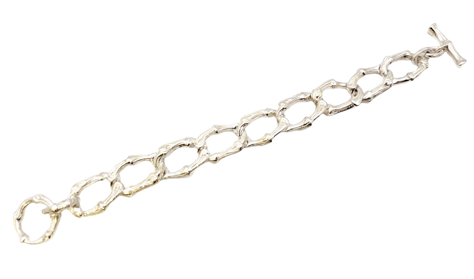 Beautiful vintage Tiffany & Co. bracelet circa 1996 made of fine polished sterling silver. The interlocking wide oval links have a unique bamboo design with toggle closure. 

Metal: Sterling Silver
Weight: 364.4 grams
Bracelet Length: 8.5