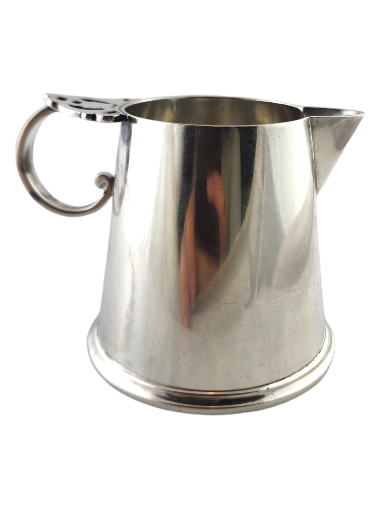 Tiffany & Co Vintage Sterling Silver Creamer Pitcher 23359

This beautiful vintage creamer was meticulously crafted from sterling silver by Tiffany & Co Makers!

c. 1956-1965

Approximate measurements
height: 2 3/4