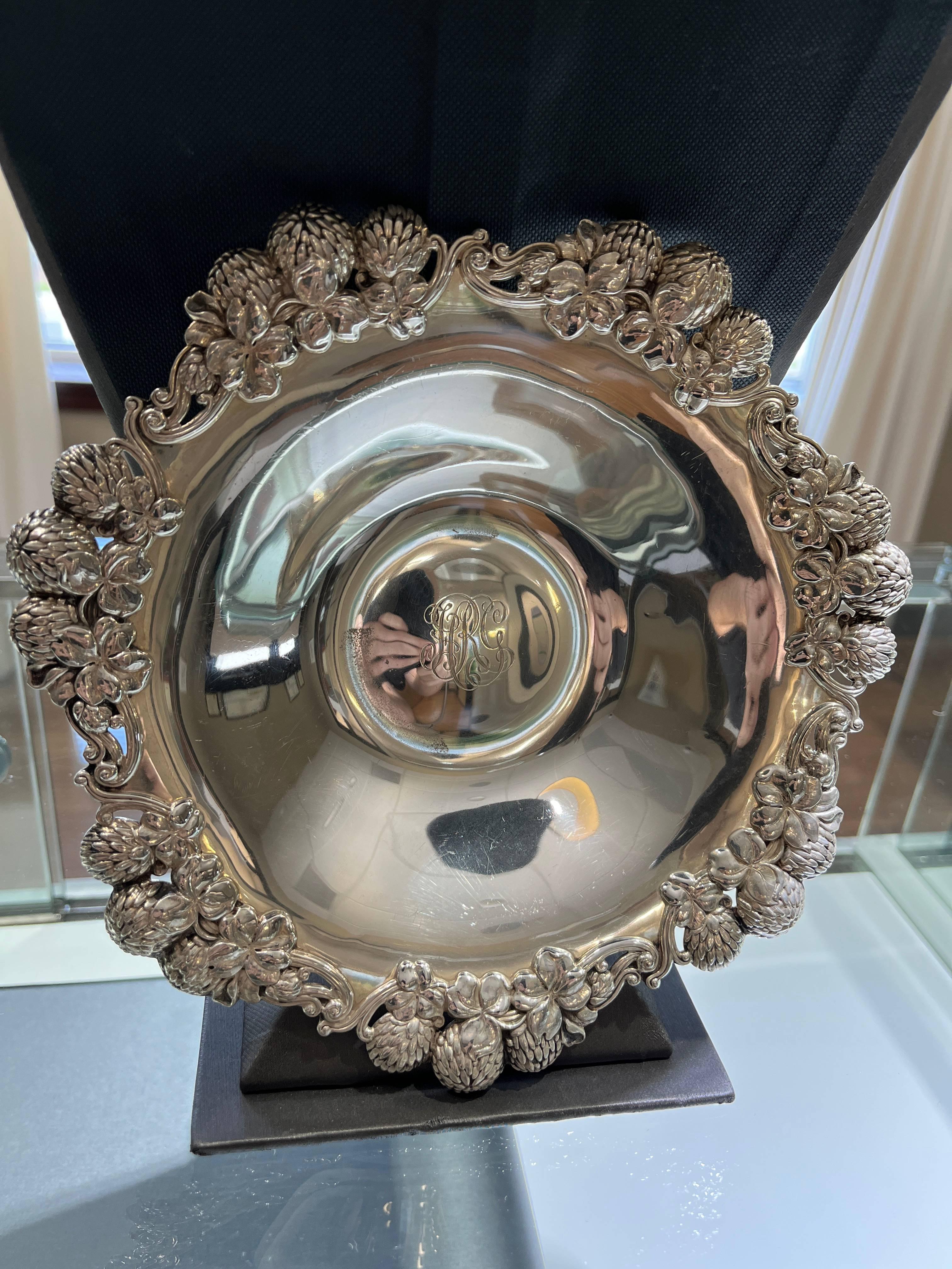 Add a touch of vintage elegance to your collection with this beautiful Tiffany & Co. sterling silver bowl. The intricate thistle and clover pattern in the Art Nouveau style is sure to impress. Crafted between 1850-1899, this bowl is a true antique