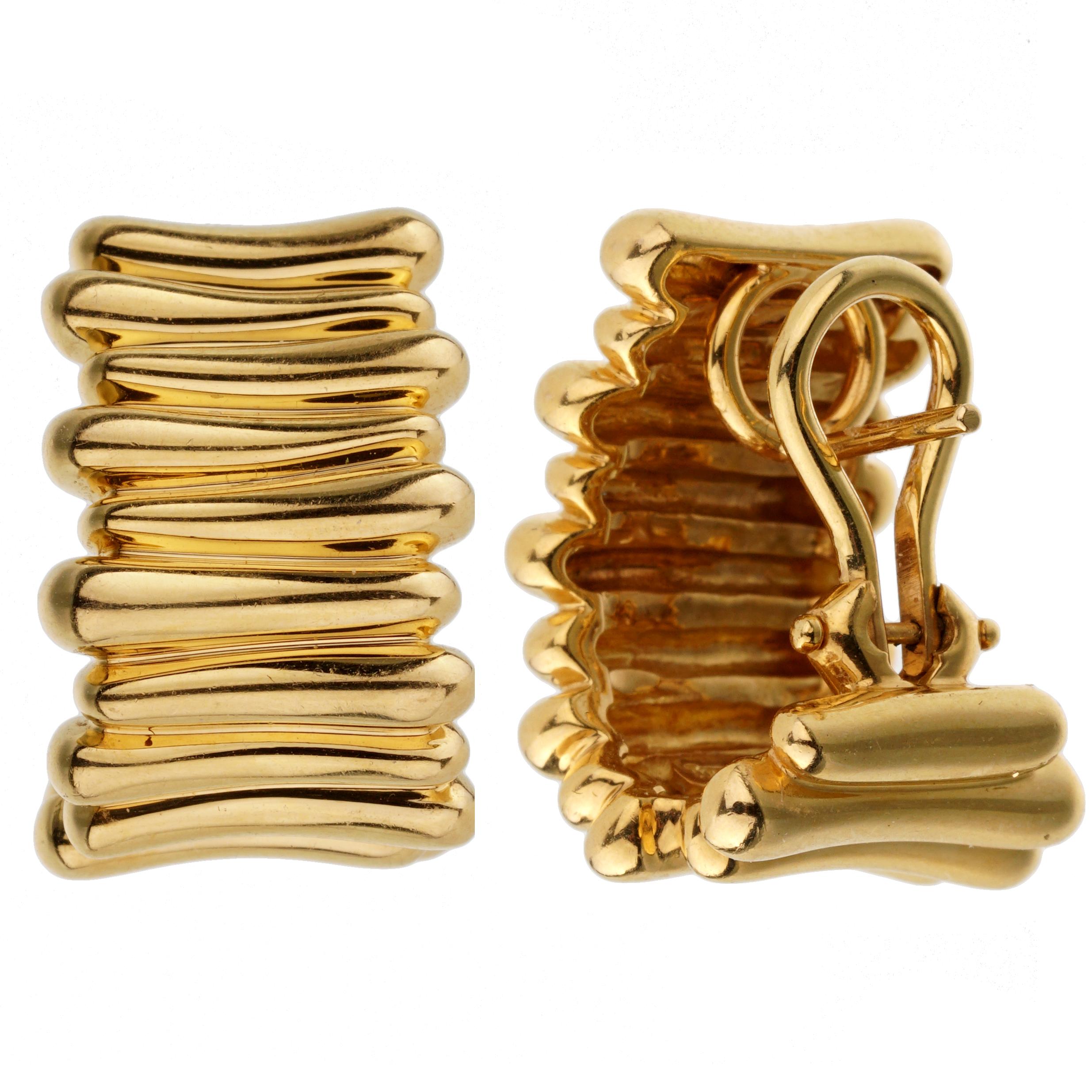 An intriguing set of Tiffany & Co earrings showcasing an overlapping yellow gold design. The earrings have a length of .78